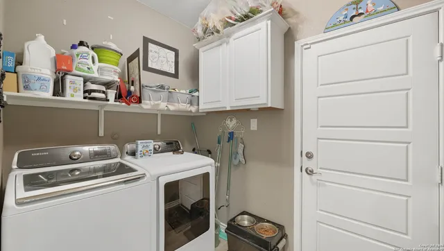 a utility room with dryer and washer