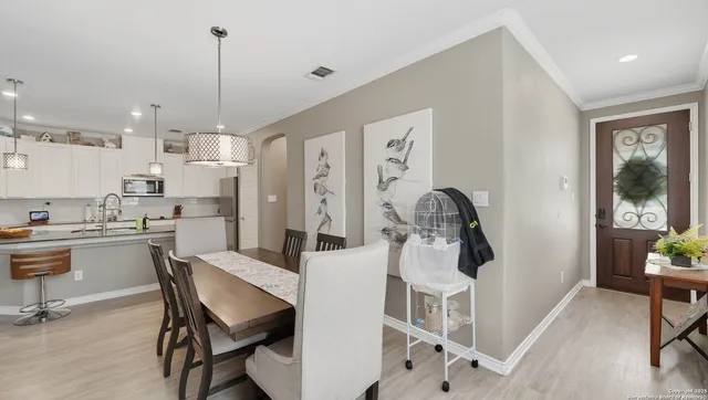 a dining room with furniture and window