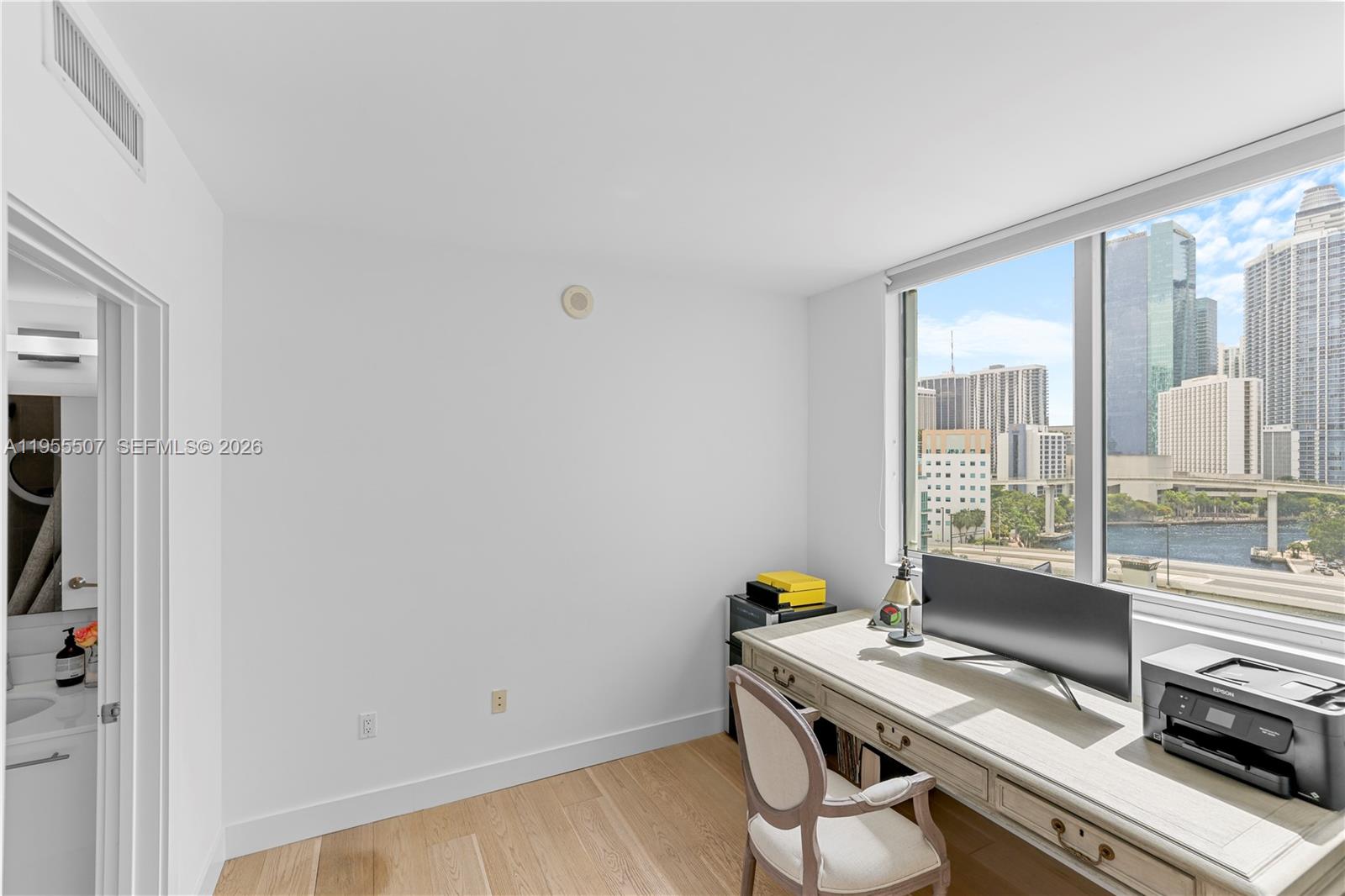 92 Southwest 3rd Street, Unit 1201 Miami, FL 33130 - Photo 23 of 31 a view of workspace with wooden floor windows