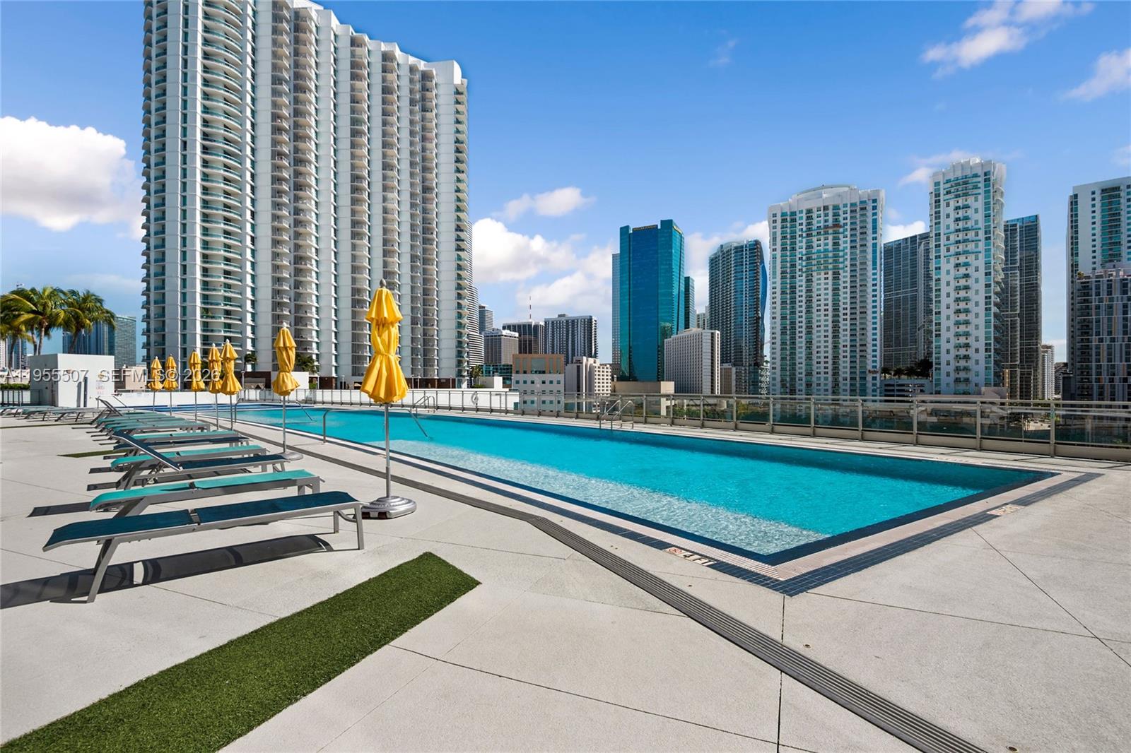 92 Southwest 3rd Street, Unit 1201 Miami, FL 33130 - Photo 30 of 31 a view of outdoor space with swimming pool and tall buildings