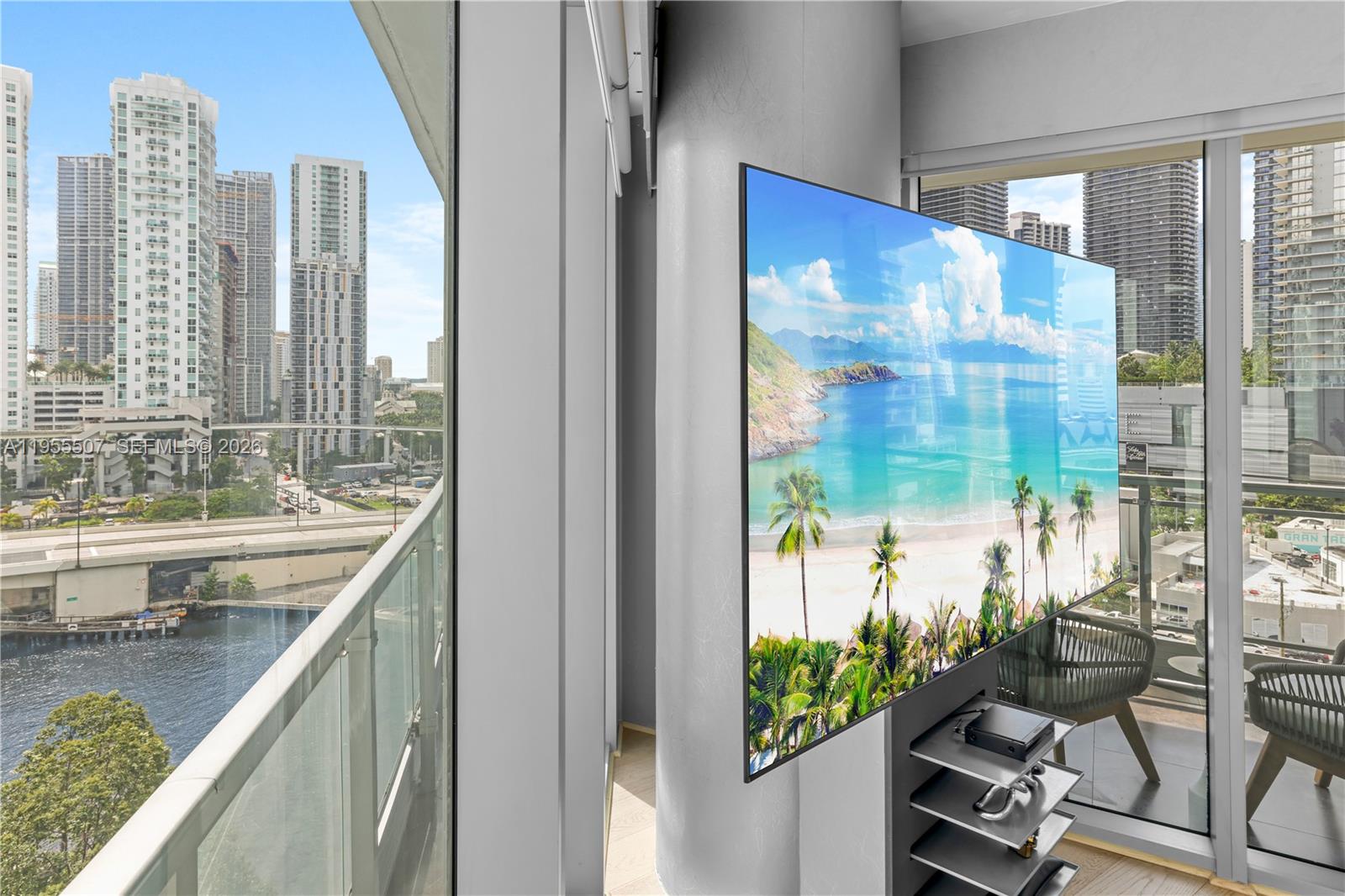 92 Southwest 3rd Street, Unit 1201 Miami, FL 33130 - Photo 4 of 31 a bathroom with a granite countertop sink and a large mirror