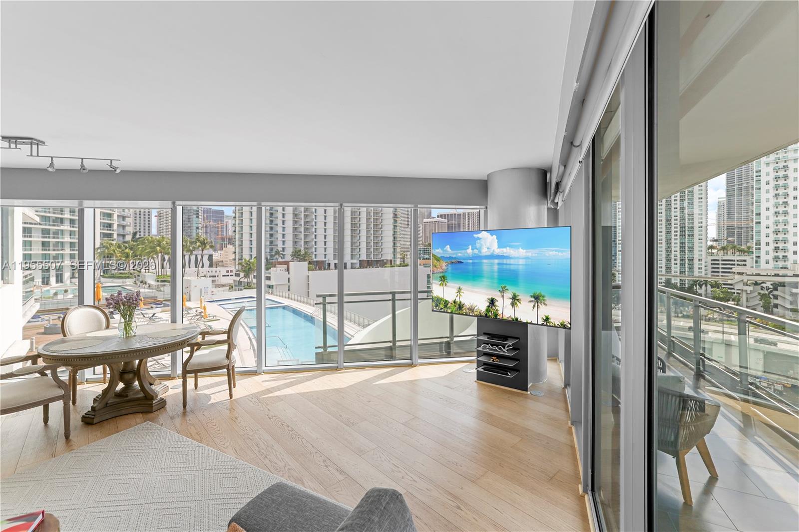 92 Southwest 3rd Street, Unit 1201 Miami, FL 33130 - Photo 6 of 31 a room with furniture and a table