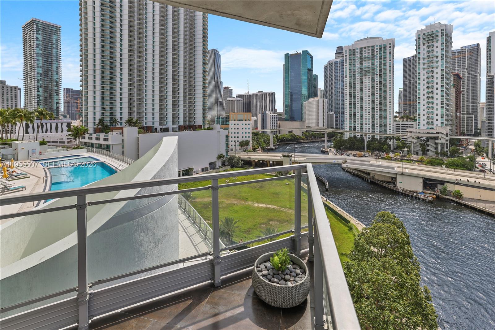 92 Southwest 3rd Street, Unit 1201 Miami, FL 33130 - Photo 8 of 31 a view of a swimming pool with outdoor seating