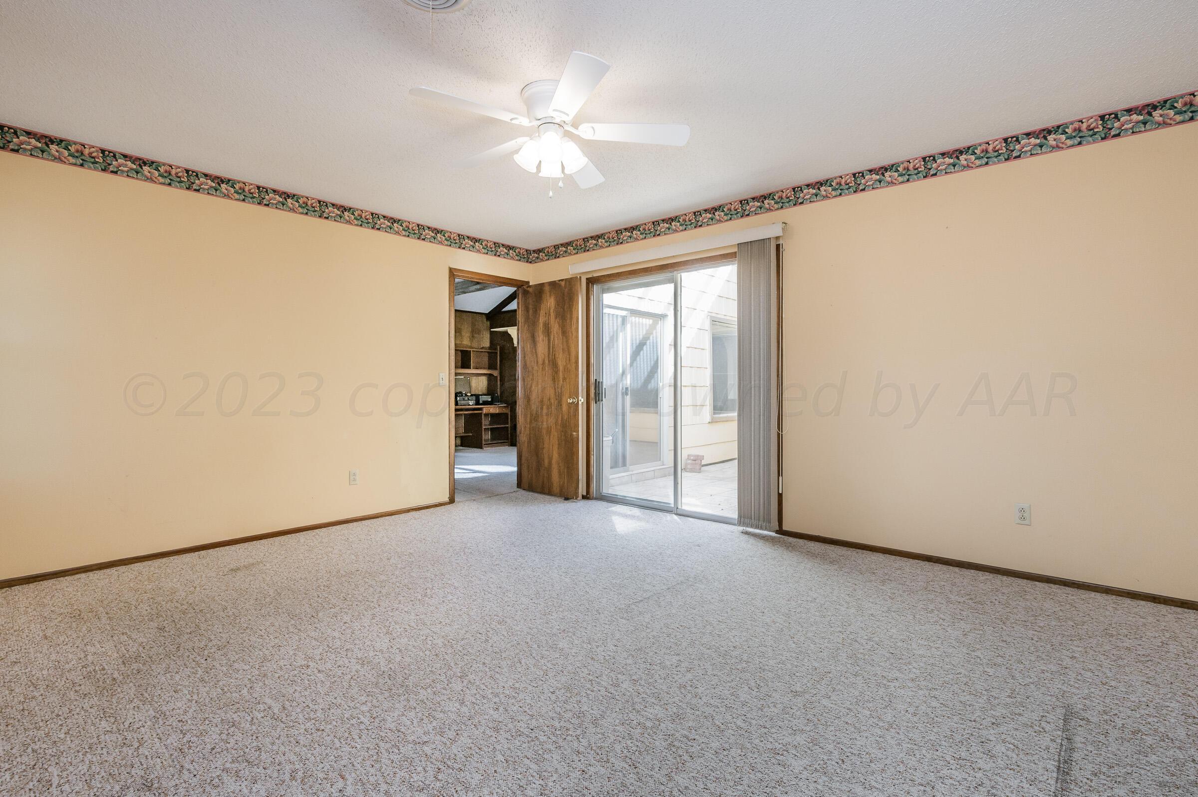 4502 Harvard Street Amarillo, TX 79109 - Photo 13 of 26 a view of an empty room with a window