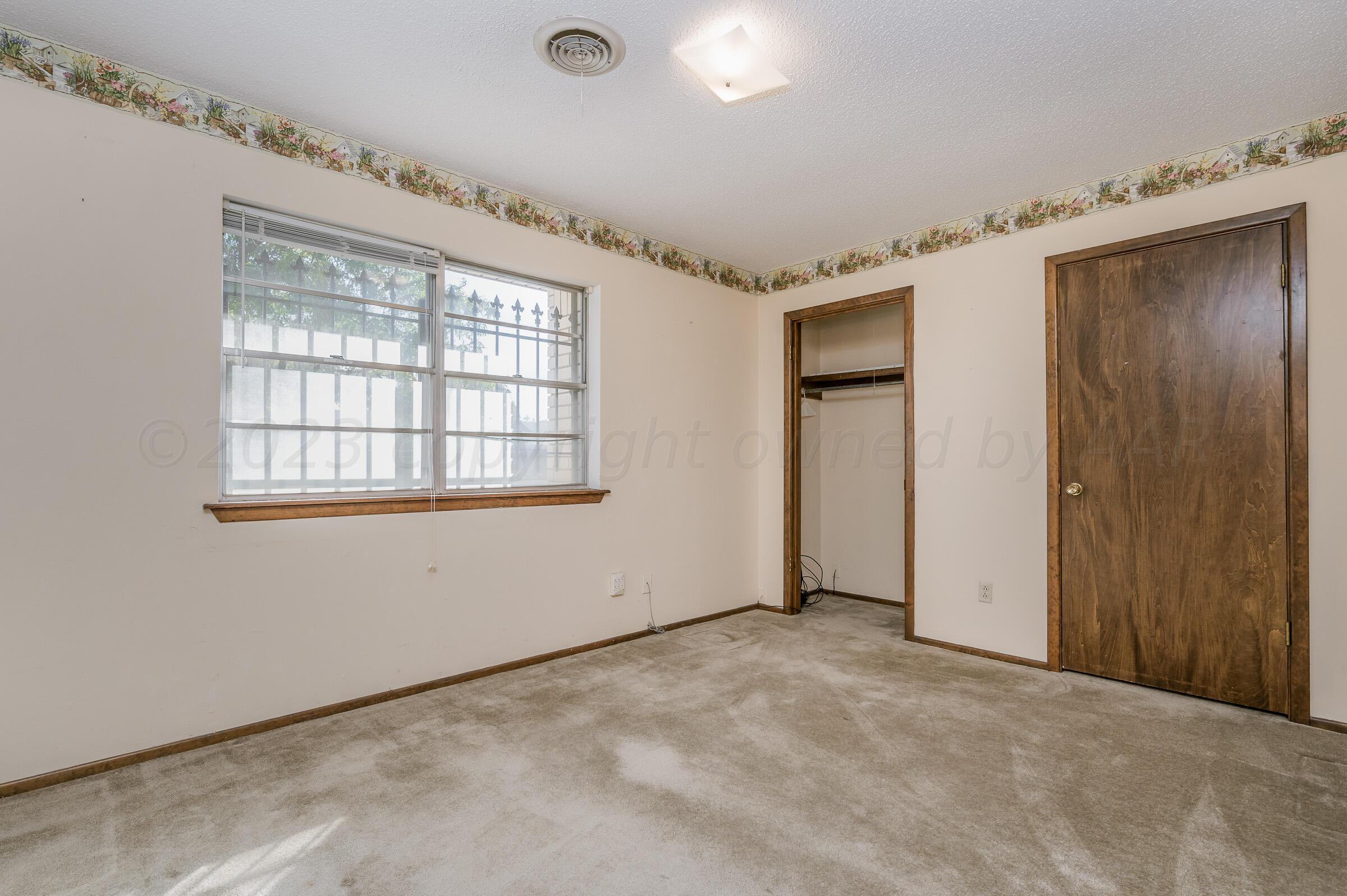 4502 Harvard Street Amarillo, TX 79109 - Photo 20 of 26 a view of an empty room with a window