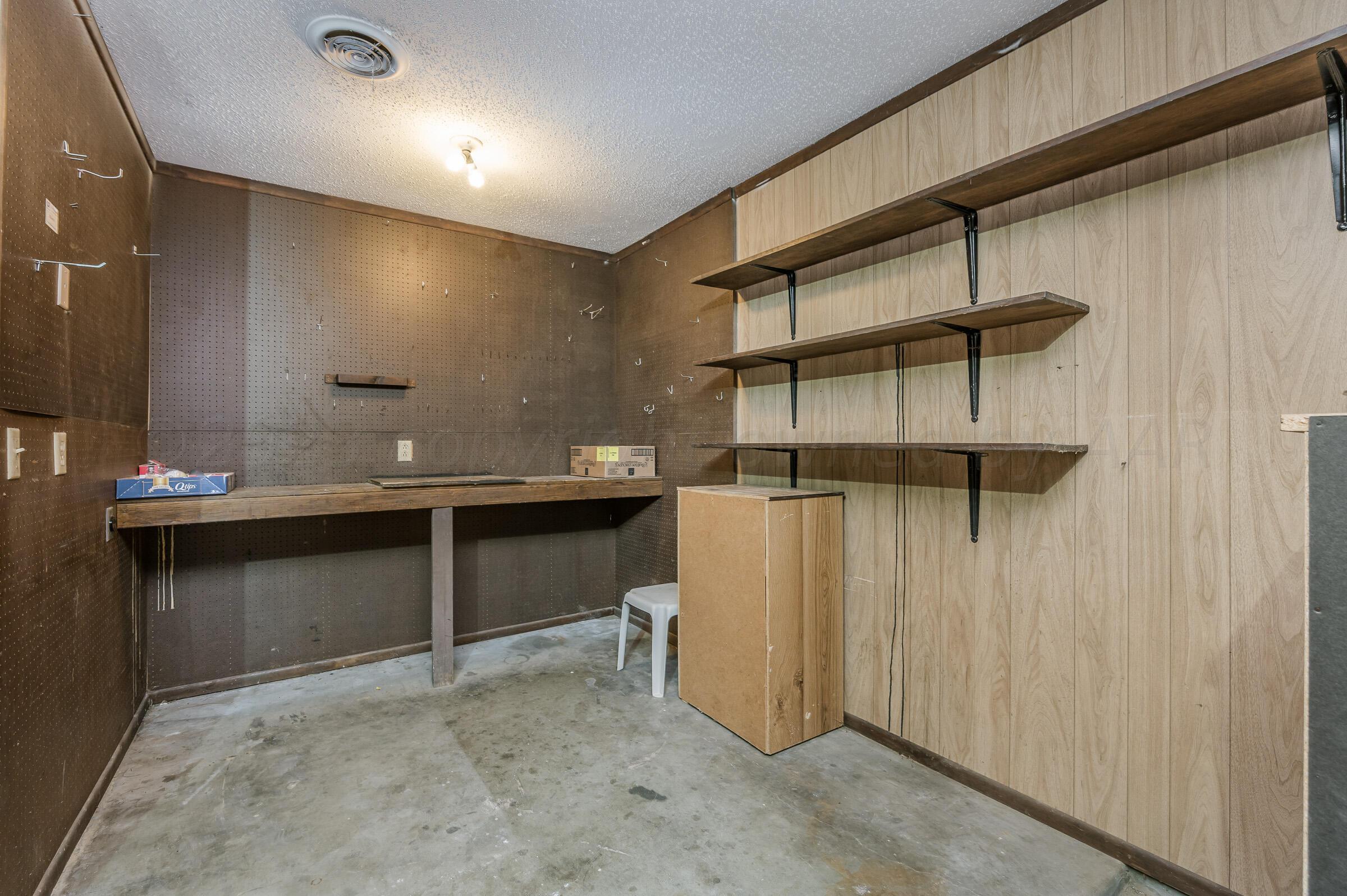 4502 Harvard Street Amarillo, TX 79109 - Photo 21 of 26 a bathroom with a sink and a mirror