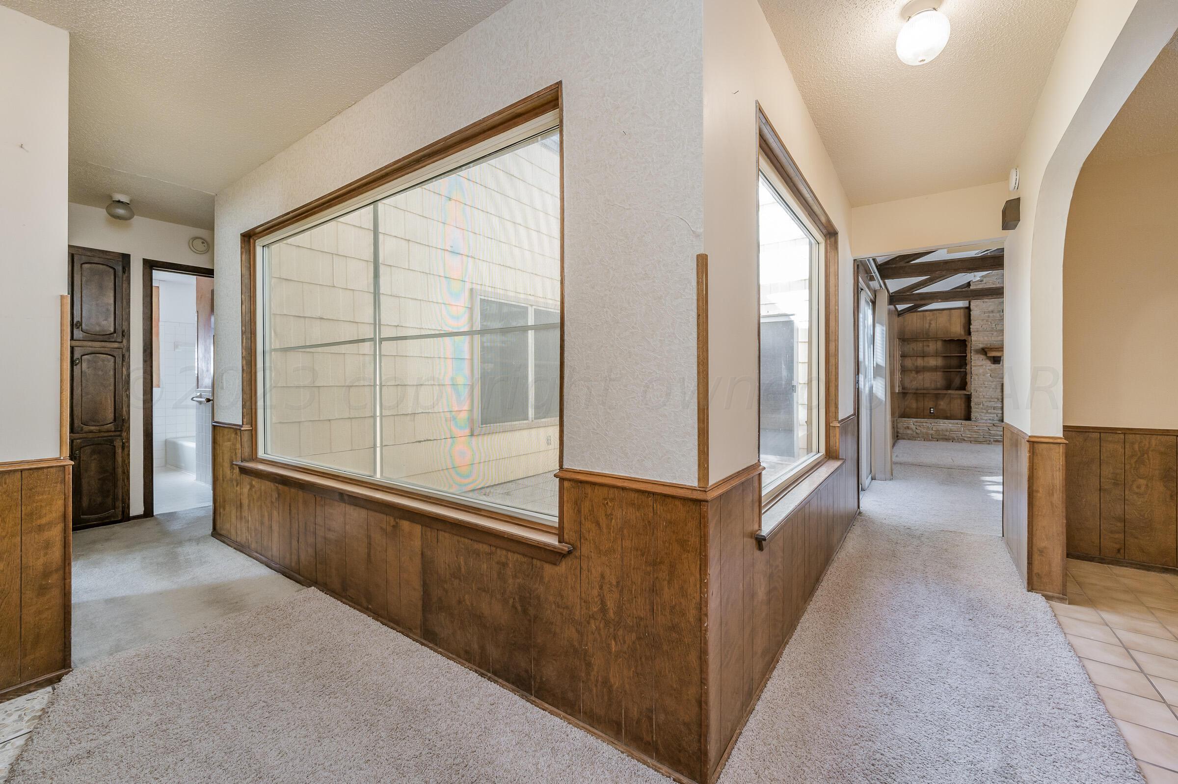 4502 Harvard Street Amarillo, TX 79109 - Photo 4 of 26 a view of a living room with a large window