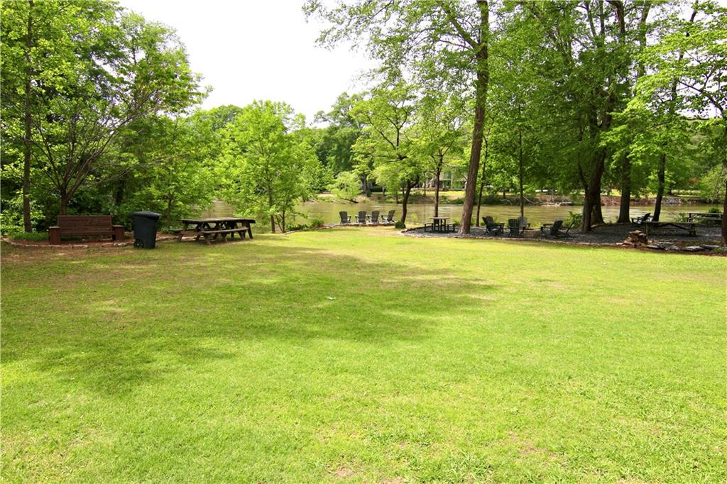 6380 River Chase Circle Northwest Sandy Springs, GA 30328 - Photo 20 of 25 a view of a swimming pool with an outdoor space and seating area