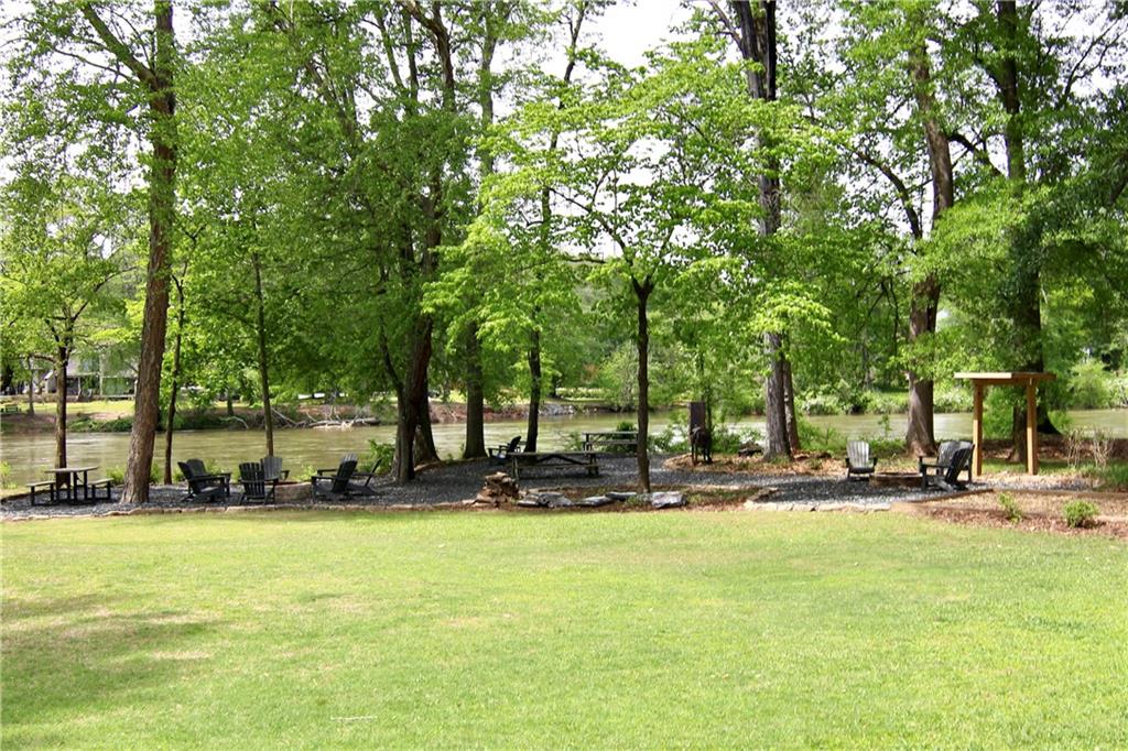 6380 River Chase Circle Northwest Sandy Springs, GA 30328 - Photo 22 of 25 a row of palm trees in front of a house