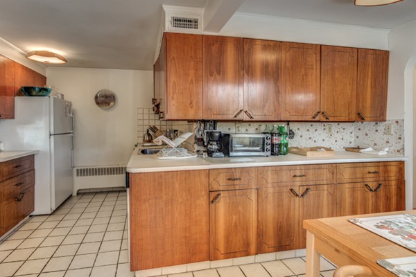 9 Wheeler Road Lexington, MA 02420 - Photo 13 of 30 a kitchen with a sink cabinets and appliances