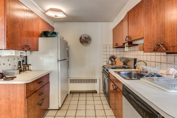 9 Wheeler Road Lexington, MA 02420 - Photo 14 of 30 a kitchen with a sink and a refrigerator
