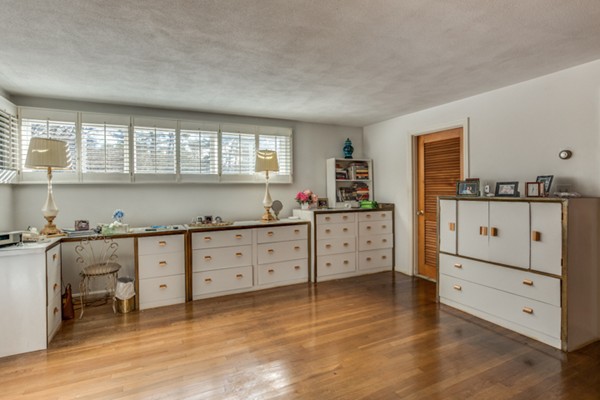 9 Wheeler Road Lexington, MA 02420 - Photo 20 of 30 a kitchen with granite countertop white cabinets and white appliances
