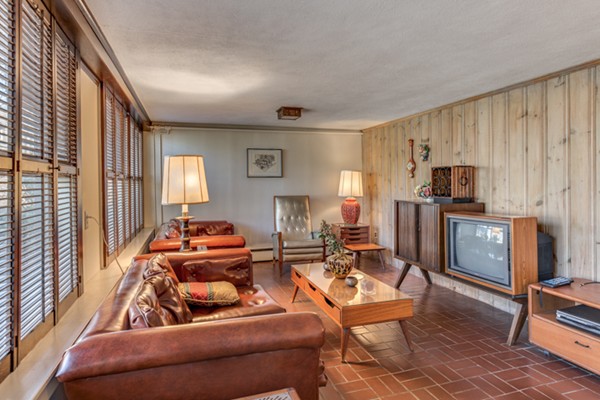 9 Wheeler Road Lexington, MA 02420 - Photo 25 of 30 a living room with furniture and a flat screen tv