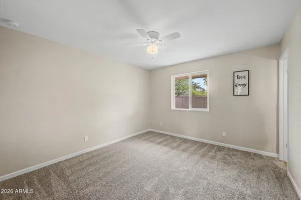 a view of a big room with carpet
