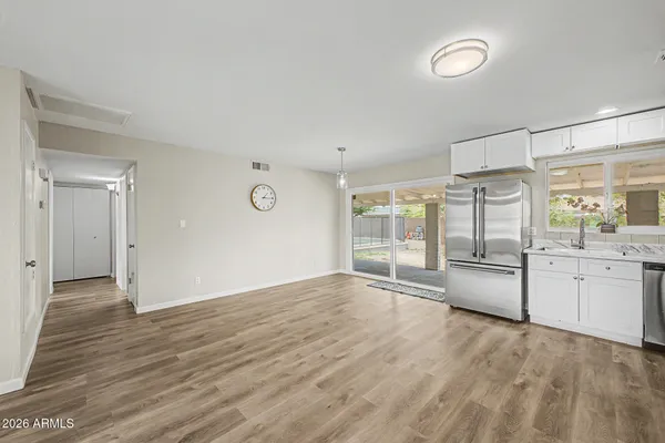 a view of kitchen refrigerator and microwave
