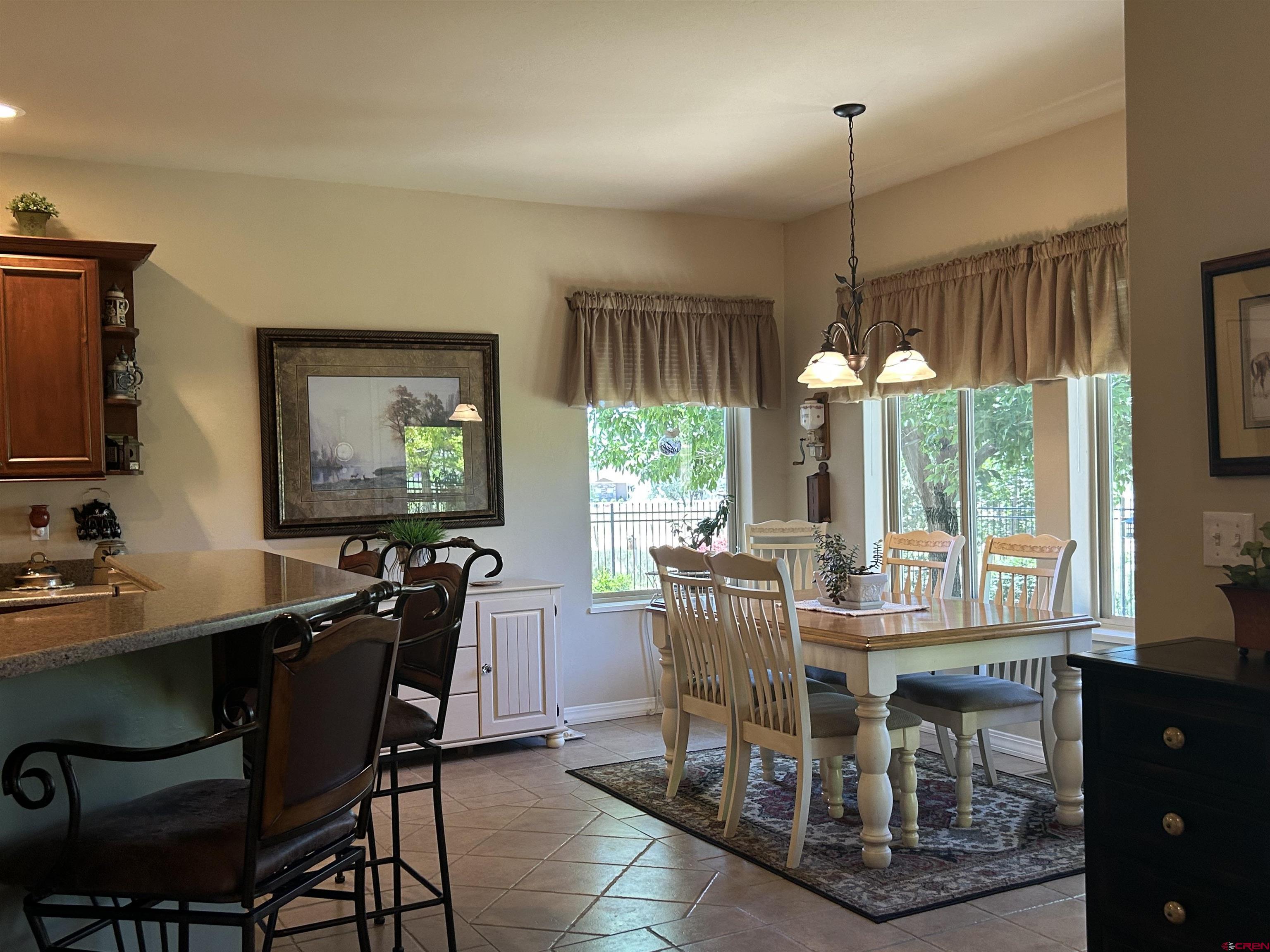 850 Southeast Pinyon Street Cedaredge, CO 81413 - Photo 14 of 45 a view of a dining room with furniture window and outside view