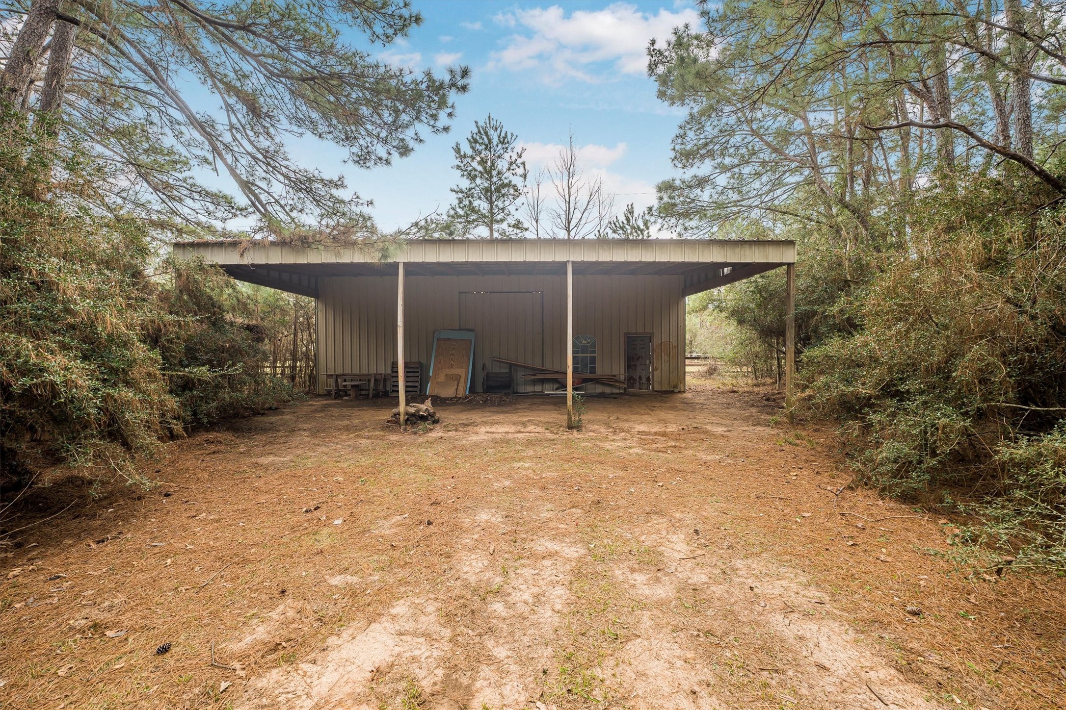 111 Whispering Meadow Magnolia, TX 77355 - Photo 13 of 49 Pole Barn with covered area