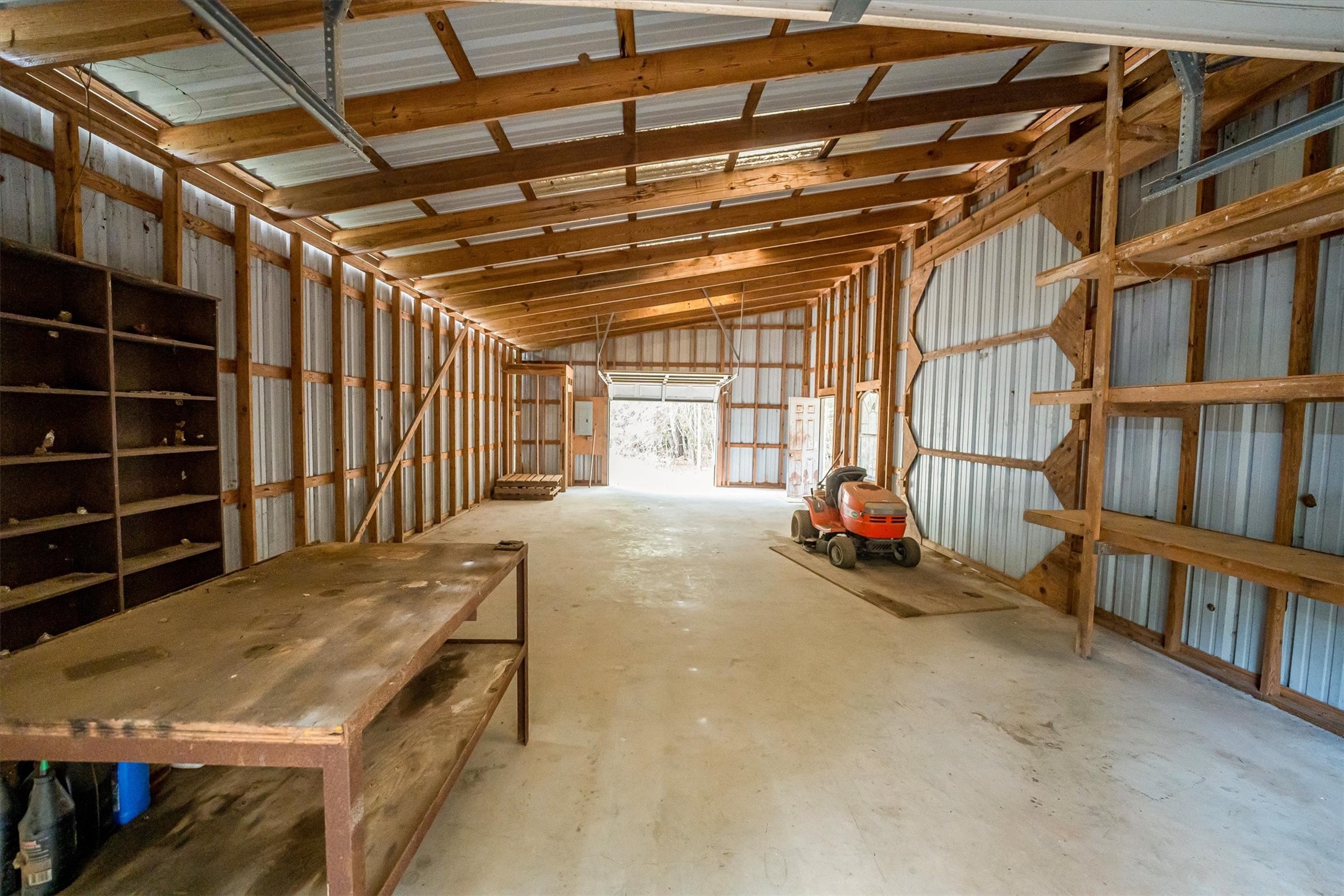 111 Whispering Meadow Magnolia, TX 77355 - Photo 15 of 49 Fantastic Workshop with two garage doors and skylights
