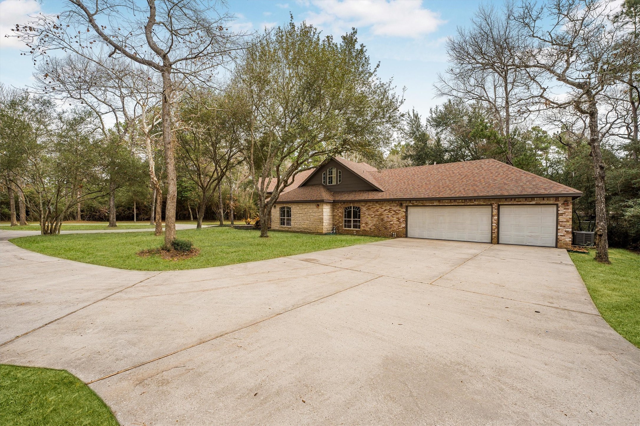 111 Whispering Meadow Magnolia, TX 77355 - Photo 16 of 49 Side of home featuring three bay garage