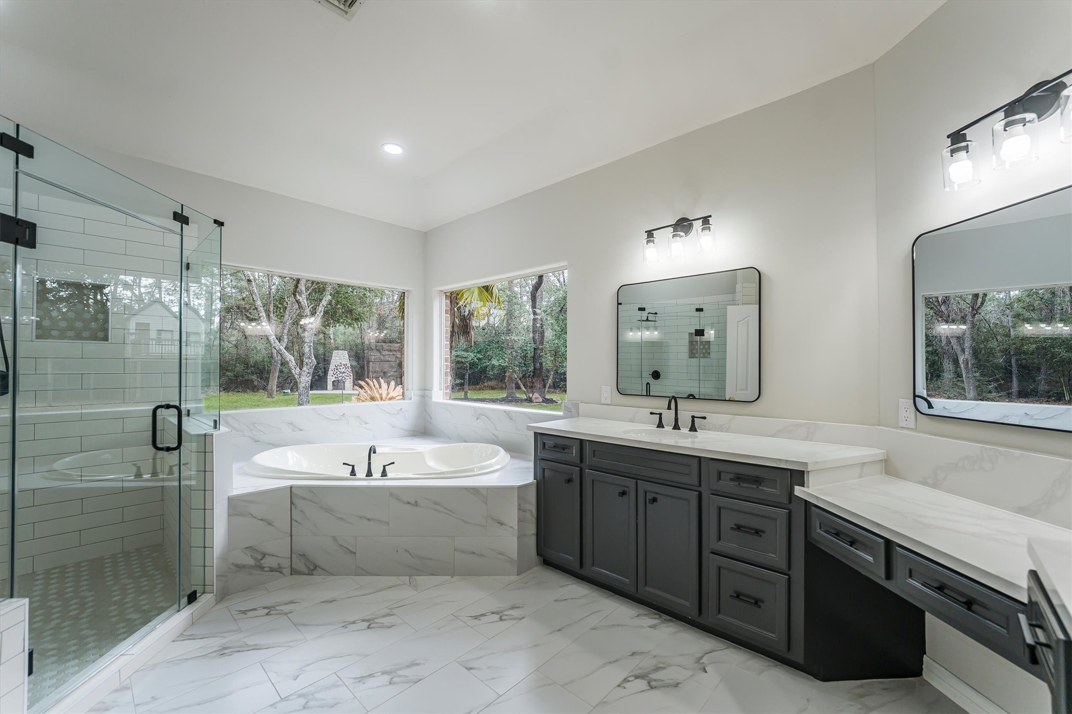 111 Whispering Meadow Magnolia, TX 77355 - Photo 27 of 49 Newly renovated Master Bathroom, hugh shower, two sinks, makeup area and jetted tub