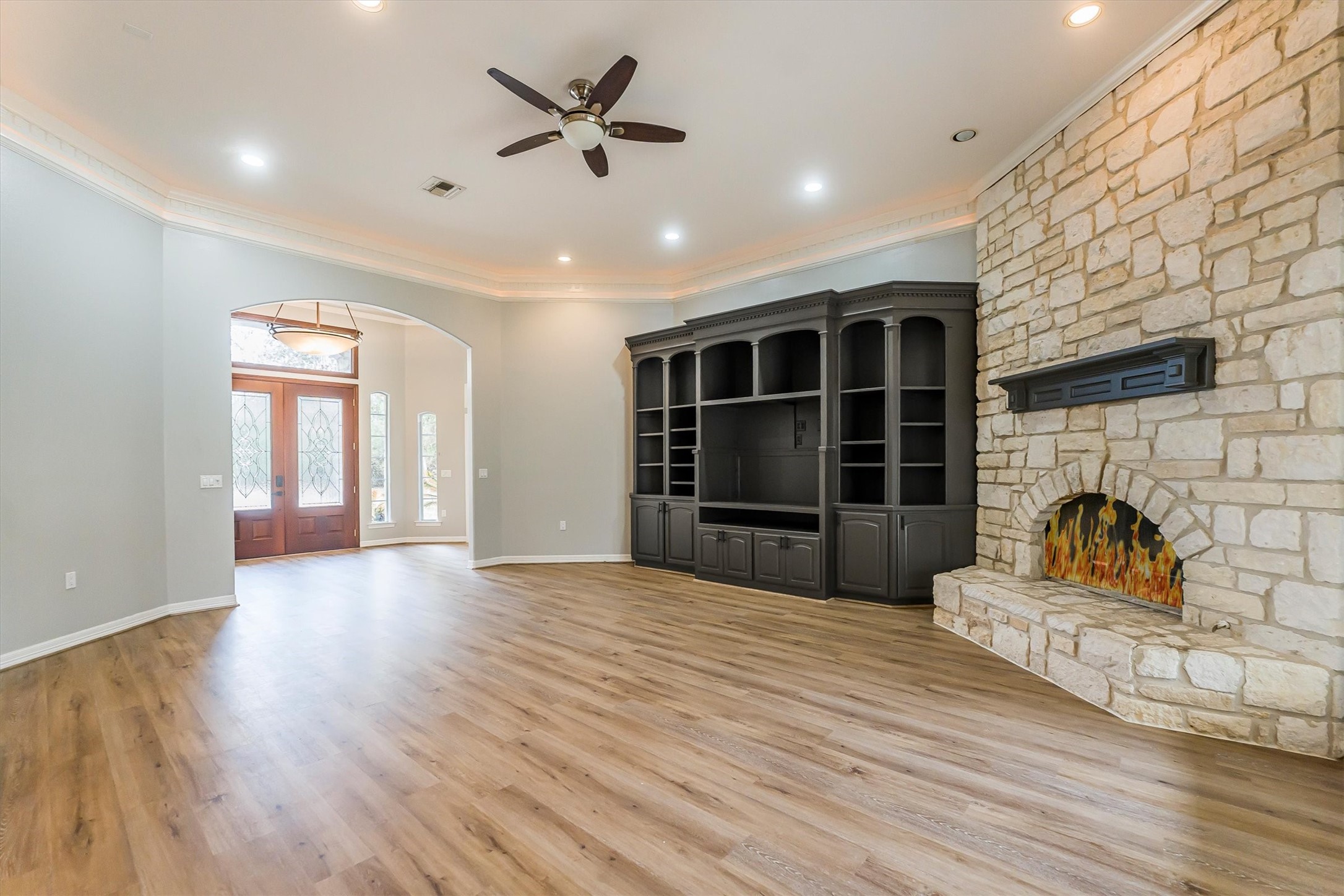 111 Whispering Meadow Magnolia, TX 77355 - Photo 32 of 49 Living Room with Built-In Entertainment and Fireplace (Open to Kitchen)
