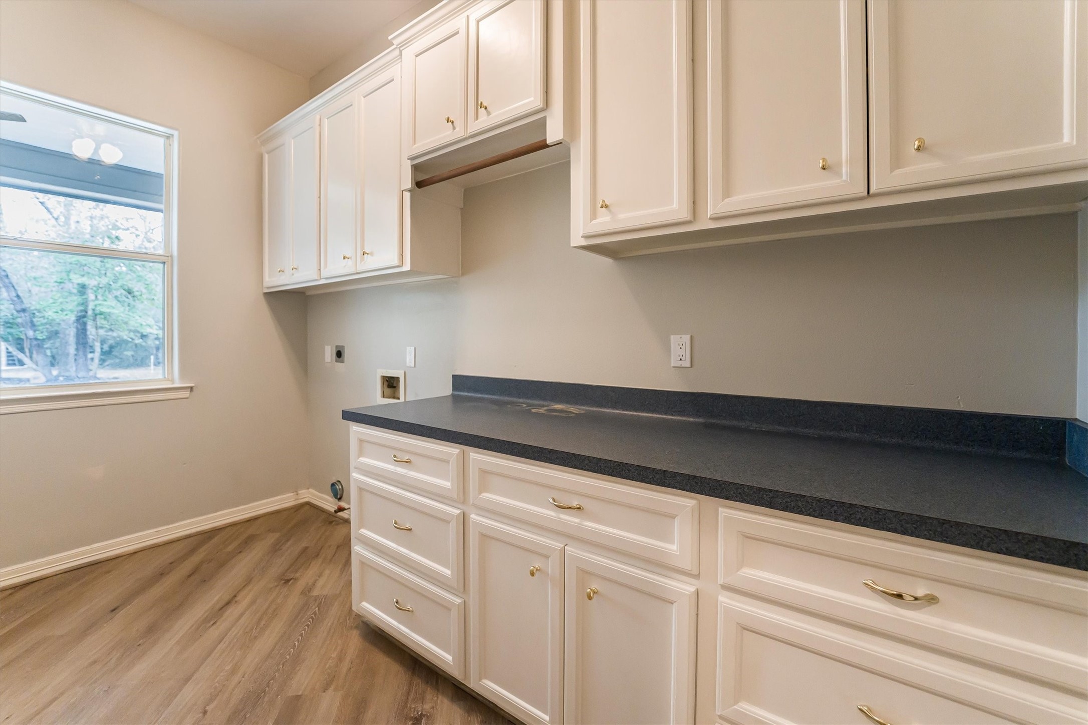 111 Whispering Meadow Magnolia, TX 77355 - Photo 40 of 49 Huge Laundry room with built-in cabinets and lots of countertop for folding.