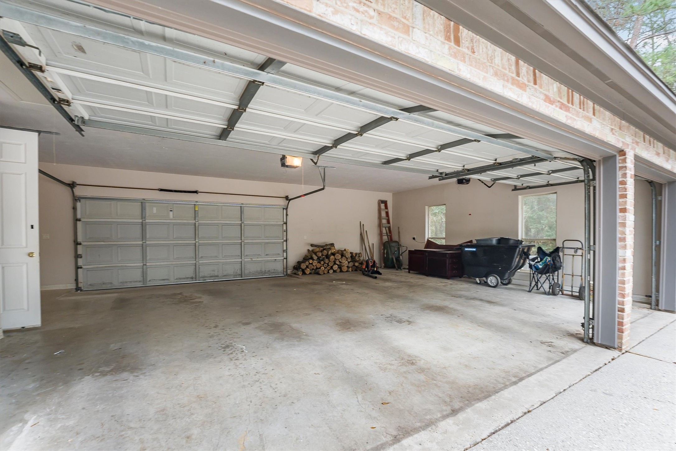 111 Whispering Meadow Magnolia, TX 77355 - Photo 41 of 49 Three bay garage, door to access the upstairs bonus room.