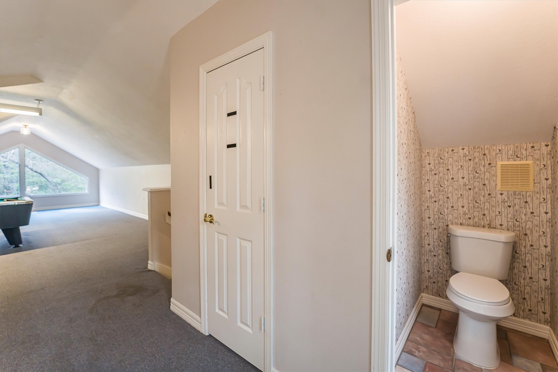111 Whispering Meadow Magnolia, TX 77355 - Photo 42 of 49 Upstairs Bonus Room, showing half bath. Adjacent Door is a walk in closet