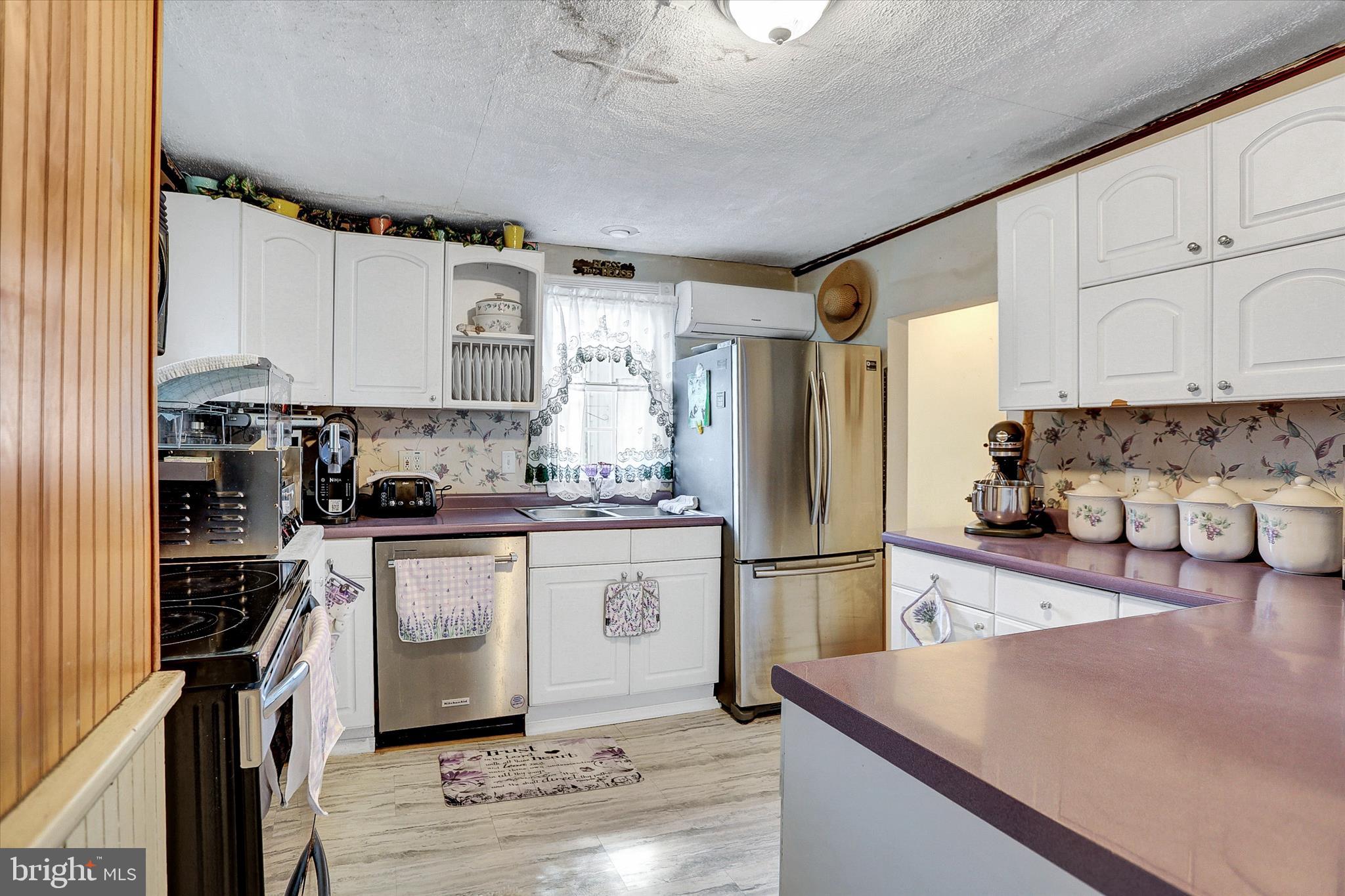 122 Shippensburg Road Newburg, PA 17240 - Photo 11 of 76 a kitchen with stainless steel appliances granite countertop a refrigerator sink and stove