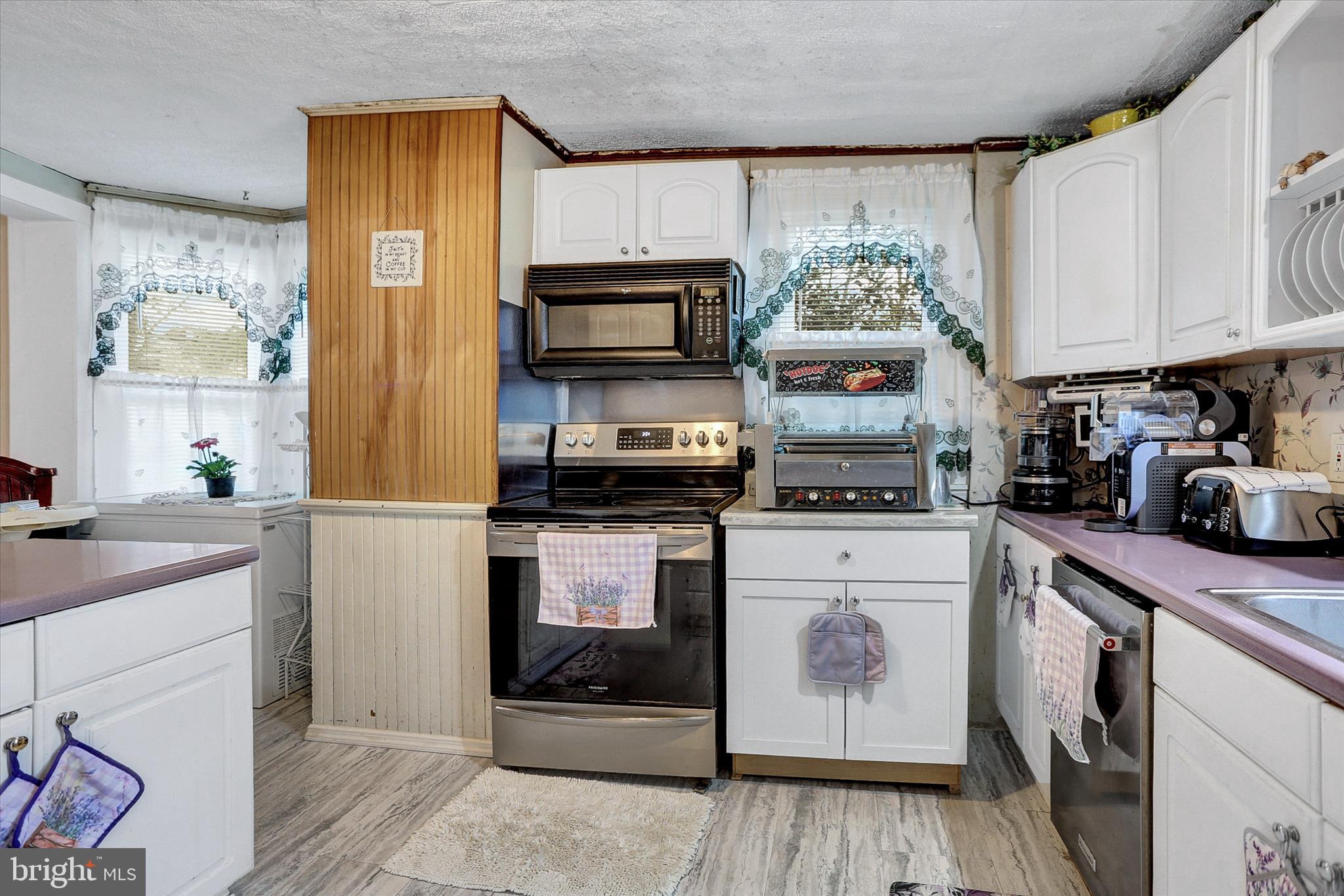 122 Shippensburg Road Newburg, PA 17240 - Photo 15 of 76 a kitchen with stainless steel appliances granite countertop a refrigerator a stove top oven a sink and dishwasher