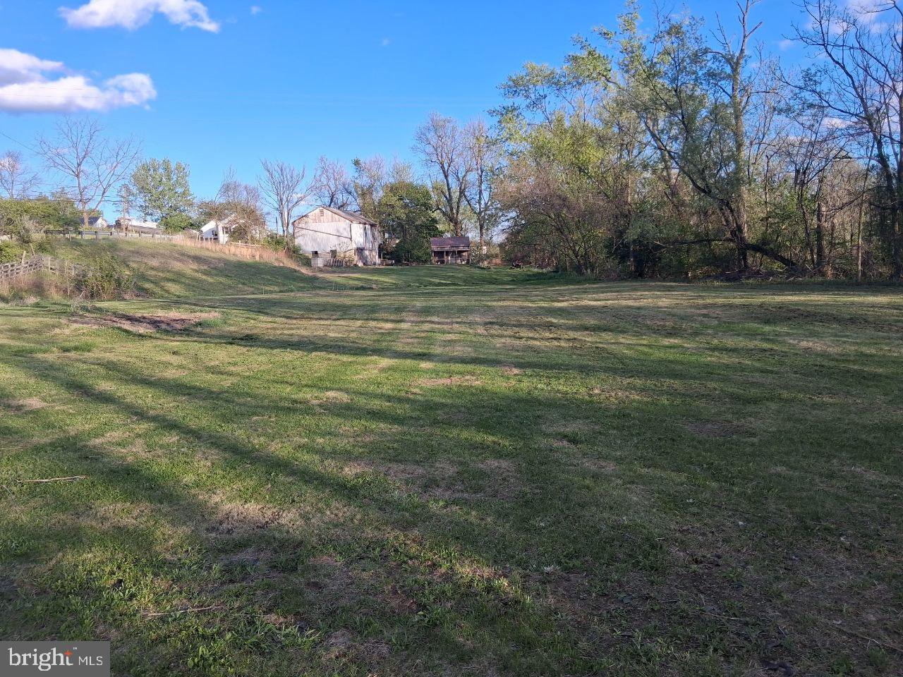 122 Shippensburg Road Newburg, PA 17240 - Photo 5 of 76 Spacious green expanse under blue skies.