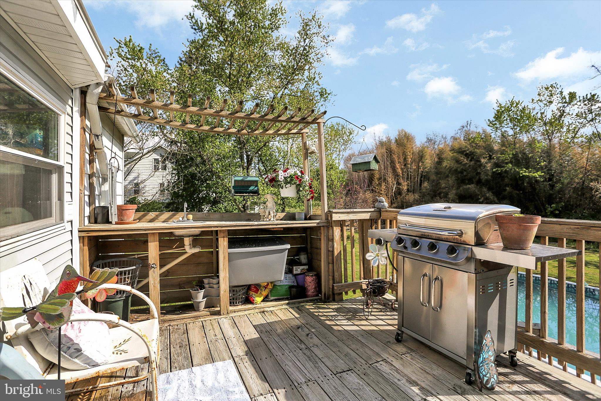 122 Shippensburg Road Newburg, PA 17240 - Photo 51 of 76 a view of a patio with table and chairs with wooden floor and fence