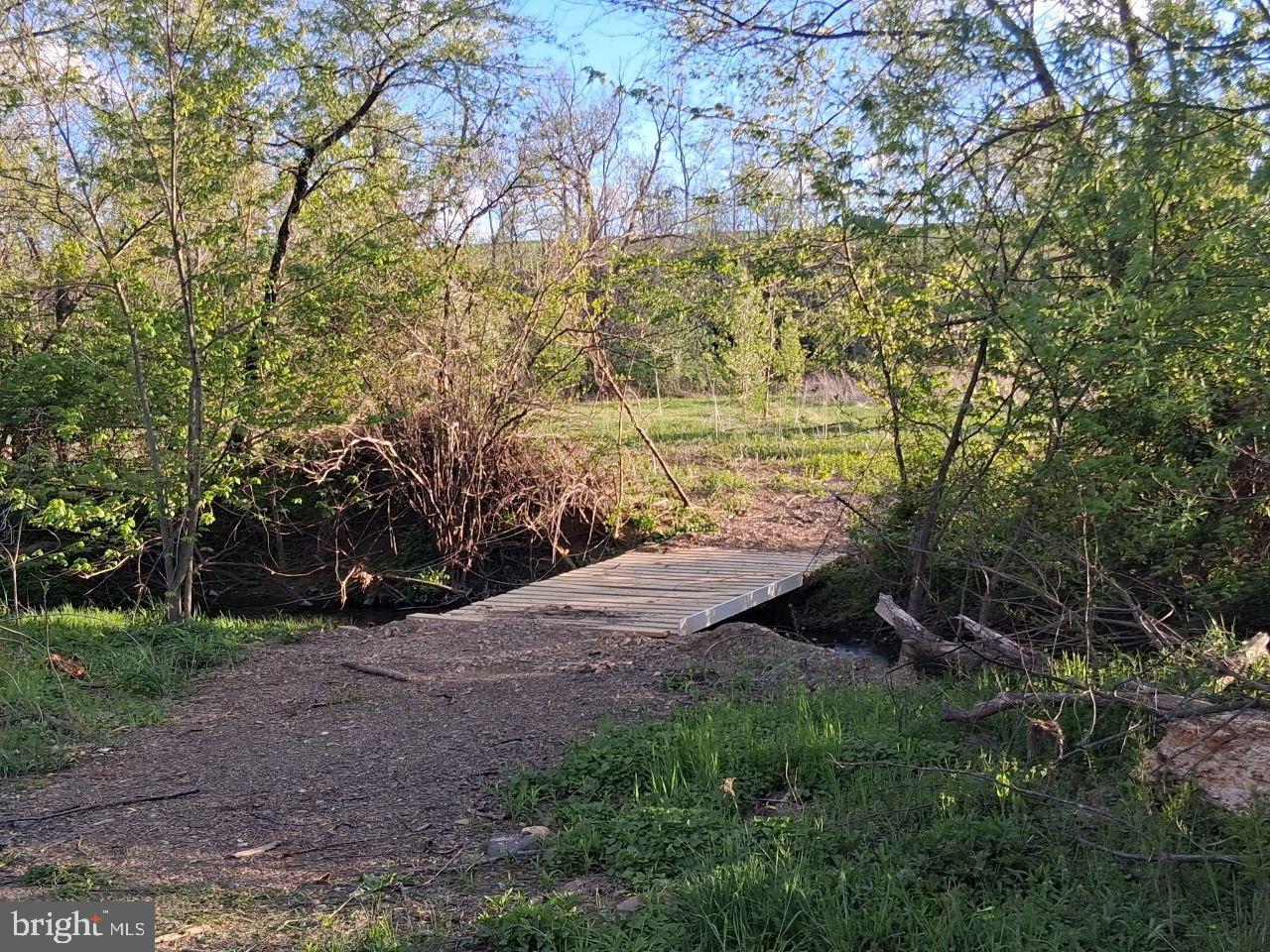 122 Shippensburg Road Newburg, PA 17240 - Photo 52 of 76 Tranquil bridge over a serene creek.