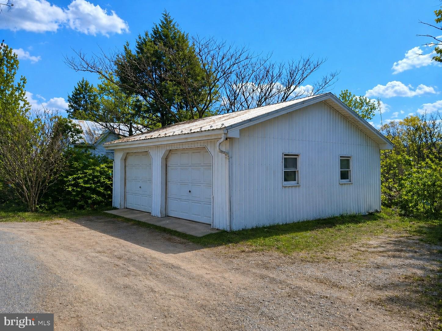 122 Shippensburg Road Newburg, PA 17240 - Photo 55 of 76 Charming white garage under blue skies.