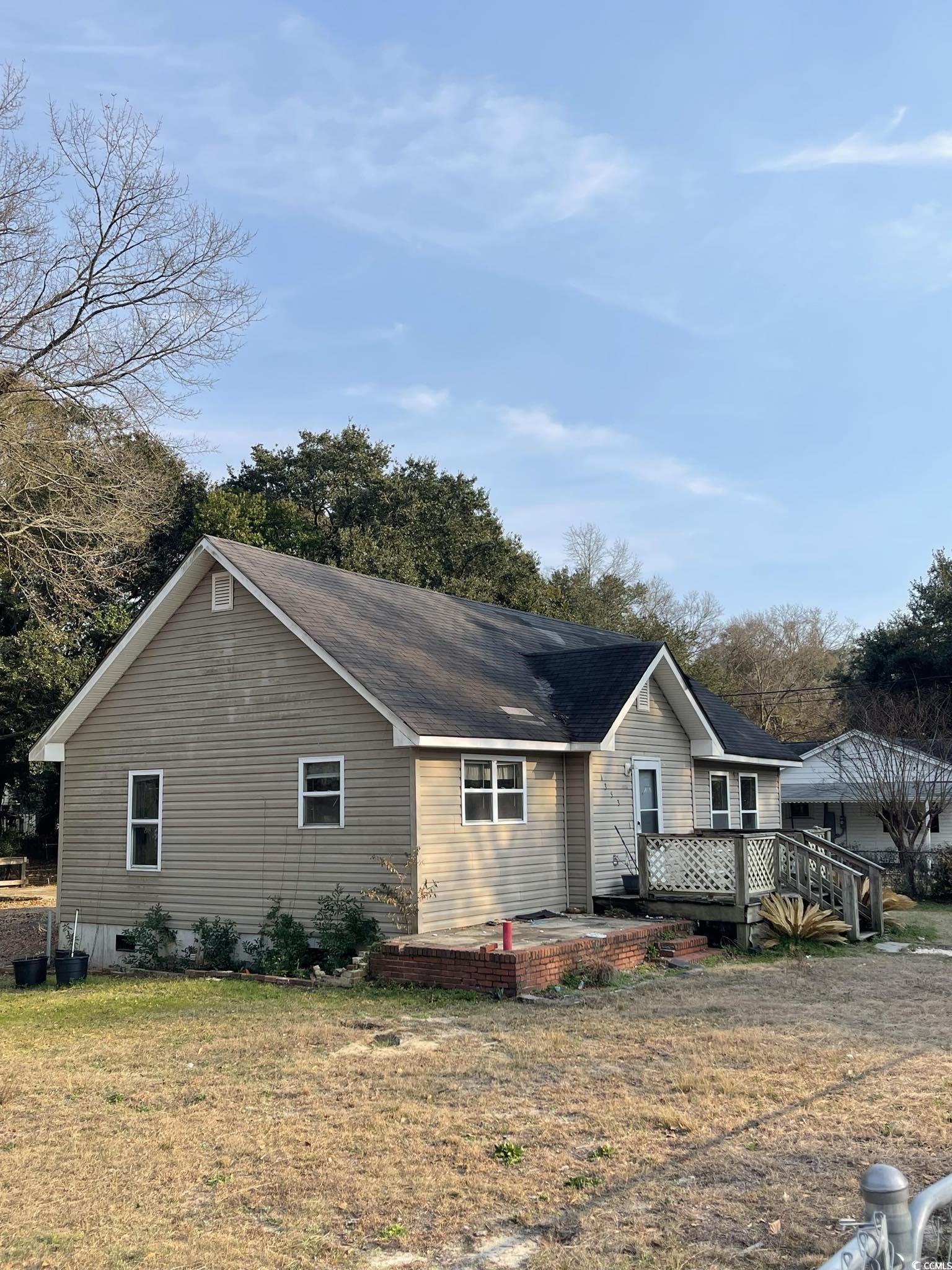 1353 Moss Street Georgetown, SC 29440 - Photo 22 of 32 Exterior space with a wooden deck, a yard, and a p