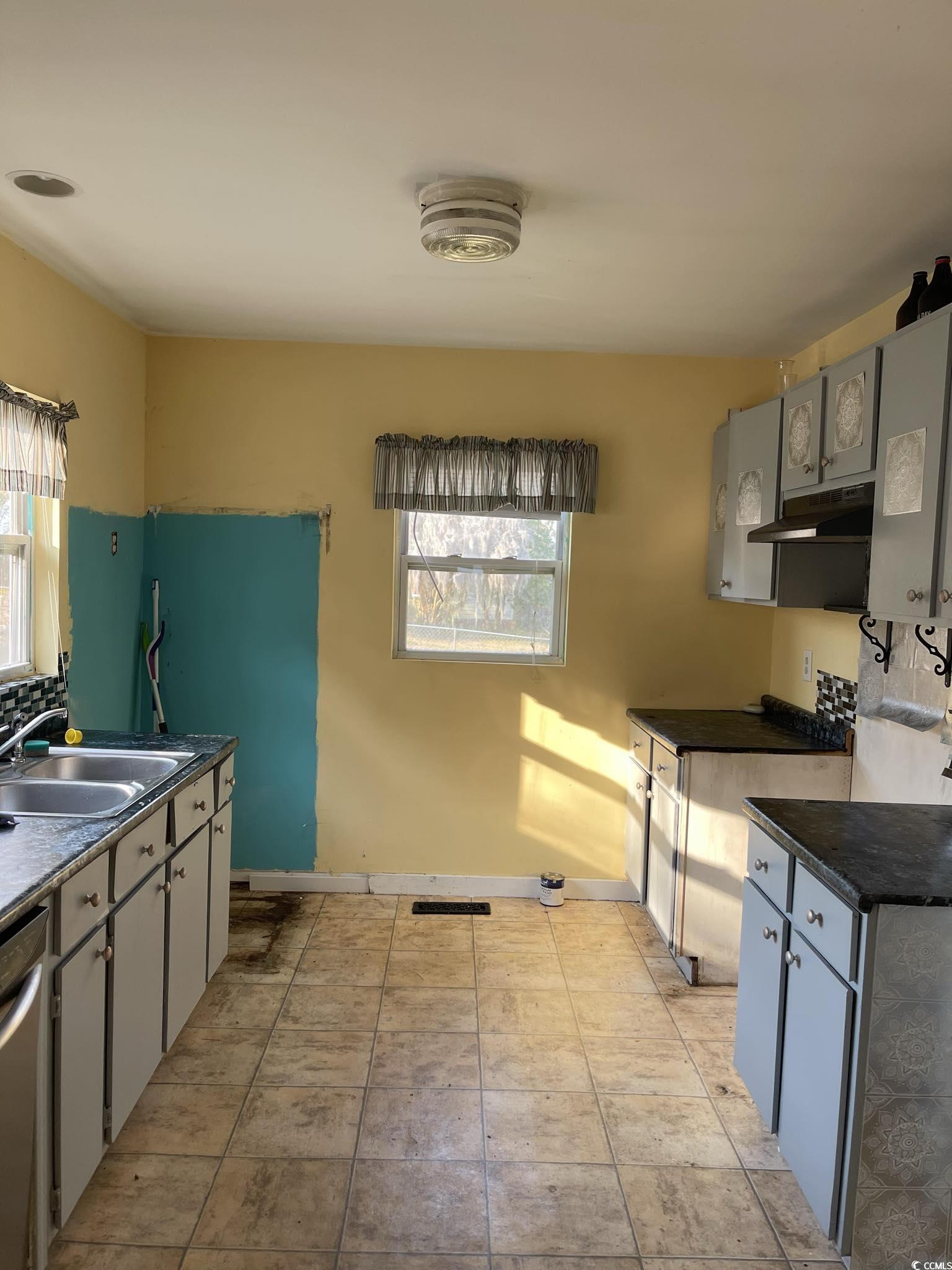 1353 Moss Street Georgetown, SC 29440 - Photo 24 of 32 Kitchen featuring gray cabinets, light tile patter