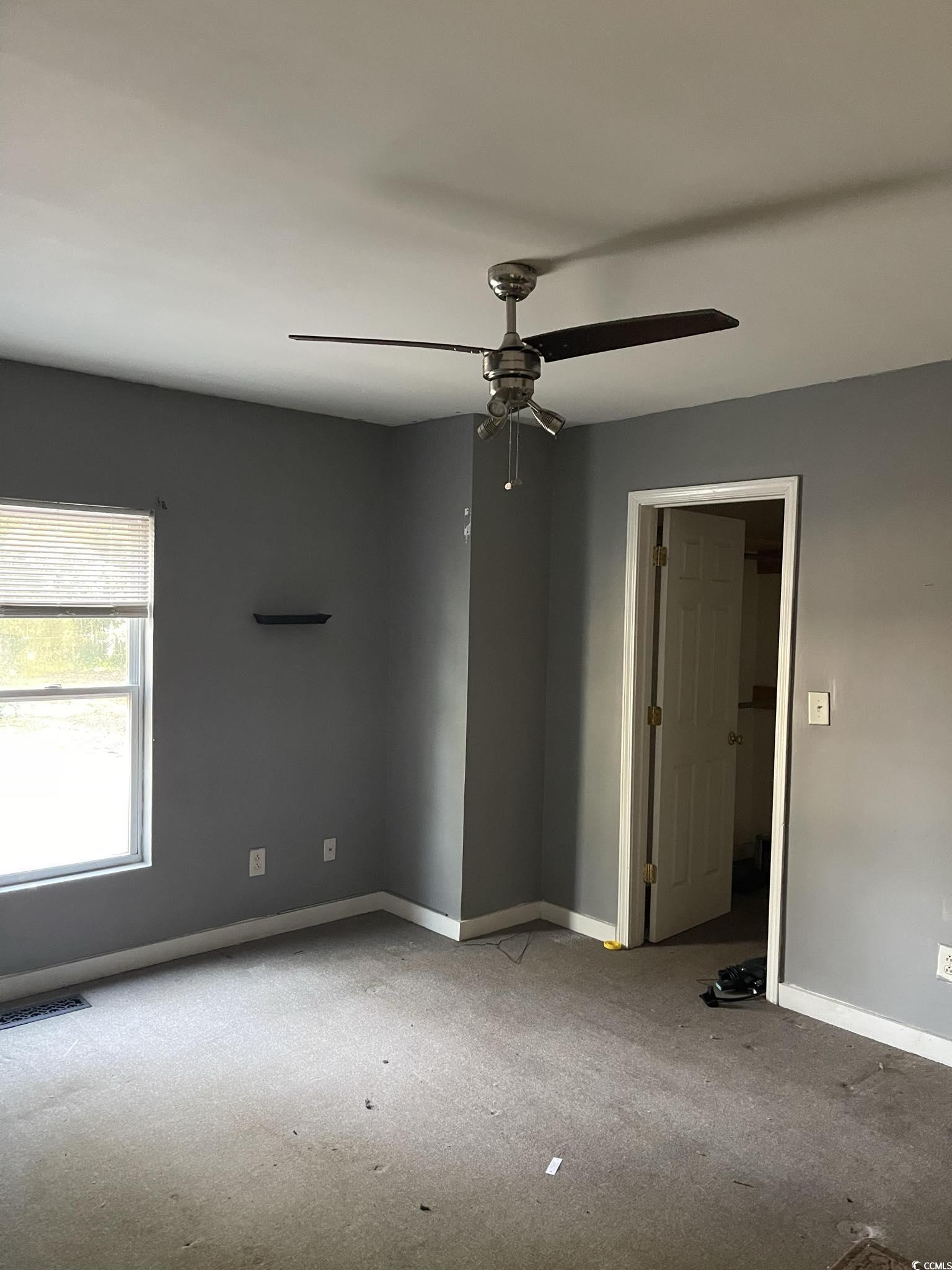 1353 Moss Street Georgetown, SC 29440 - Photo 8 of 32 Empty room featuring ceiling fan
