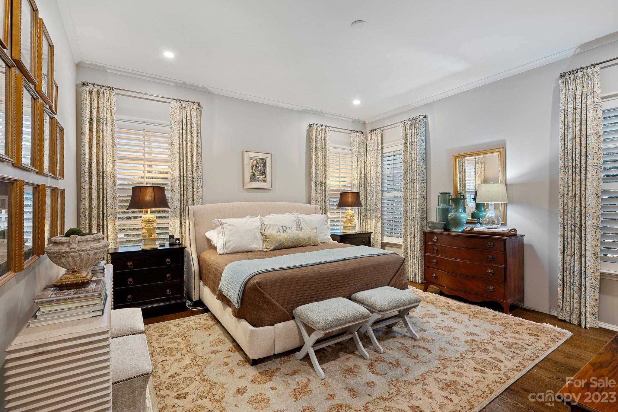 1401 Audubon Road Charlotte, NC 28211 - Photo 15 of 39 a bedroom with a bed and wooden floor