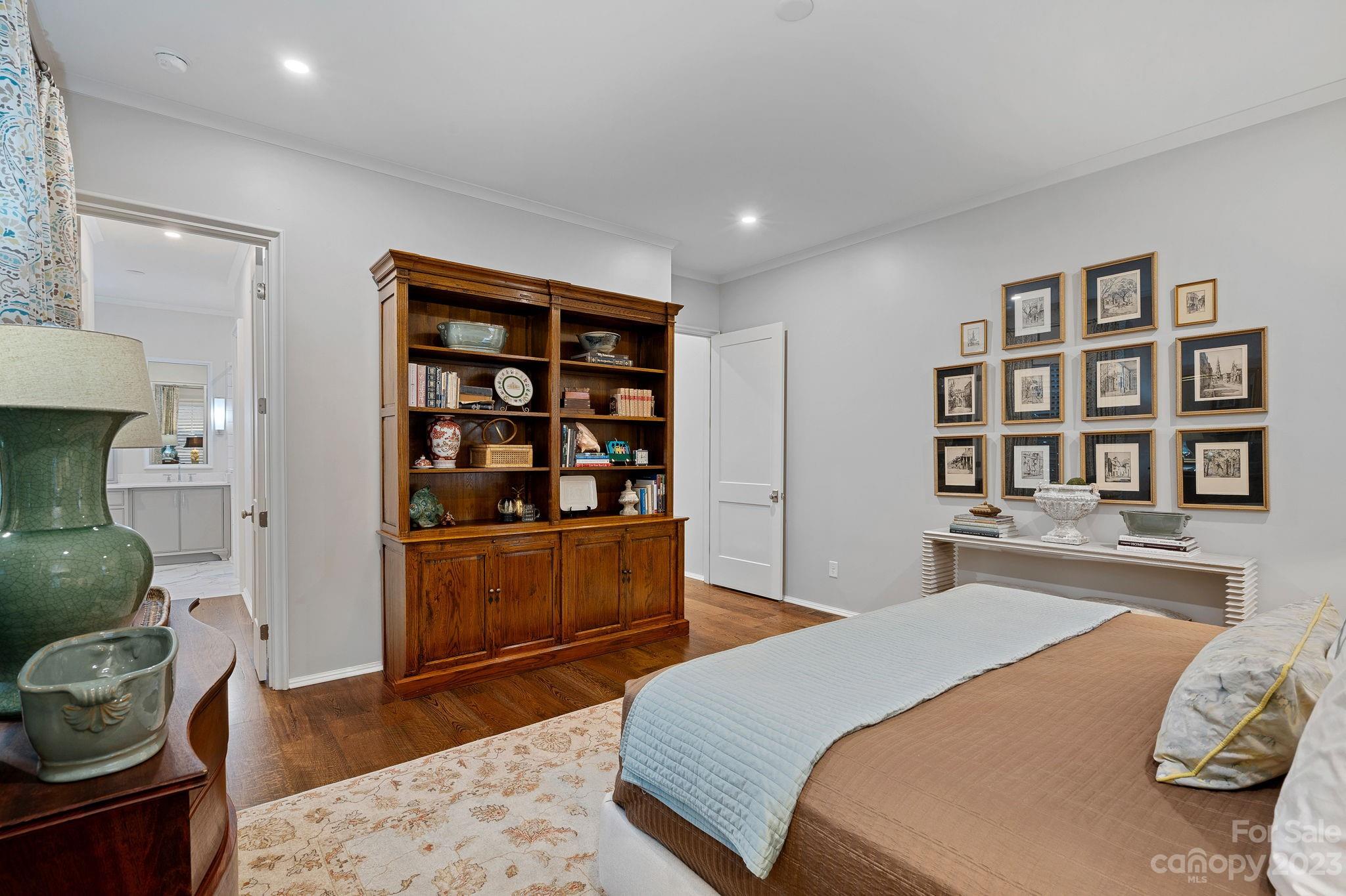 1401 Audubon Road Charlotte, NC 28211 - Photo 16 of 39 a bedroom with a bed and a dresser in it
