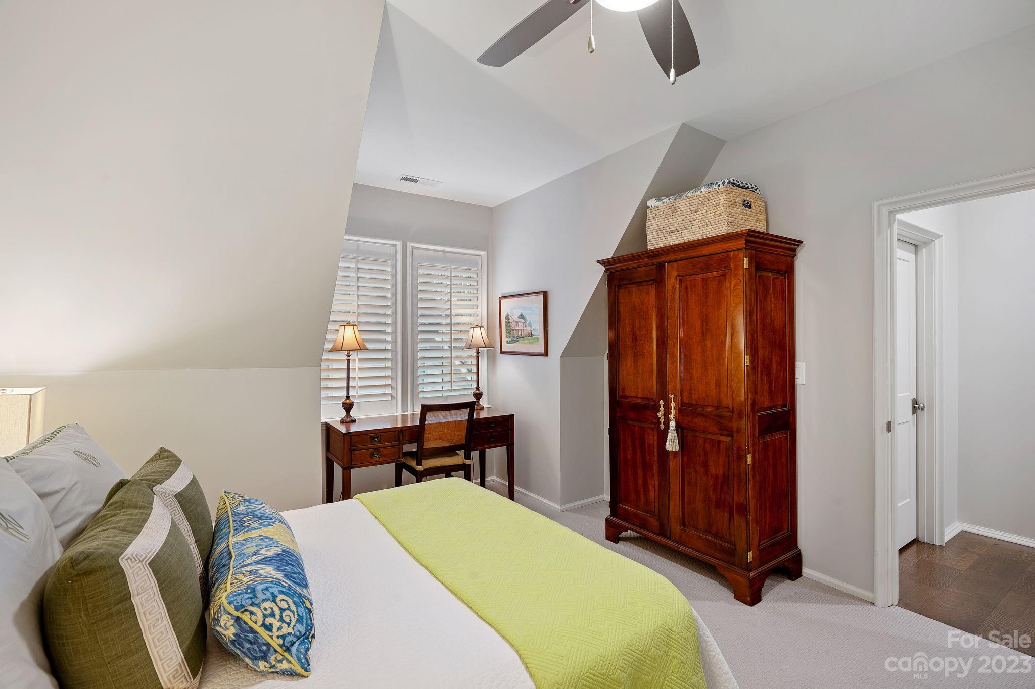 1401 Audubon Road Charlotte, NC 28211 - Photo 23 of 39 a bedroom with a bed and a chandelier