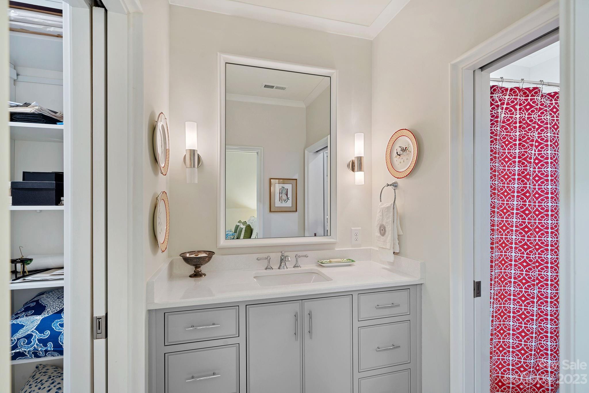 1401 Audubon Road Charlotte, NC 28211 - Photo 24 of 39 a bathroom with a sink a mirror and a shower