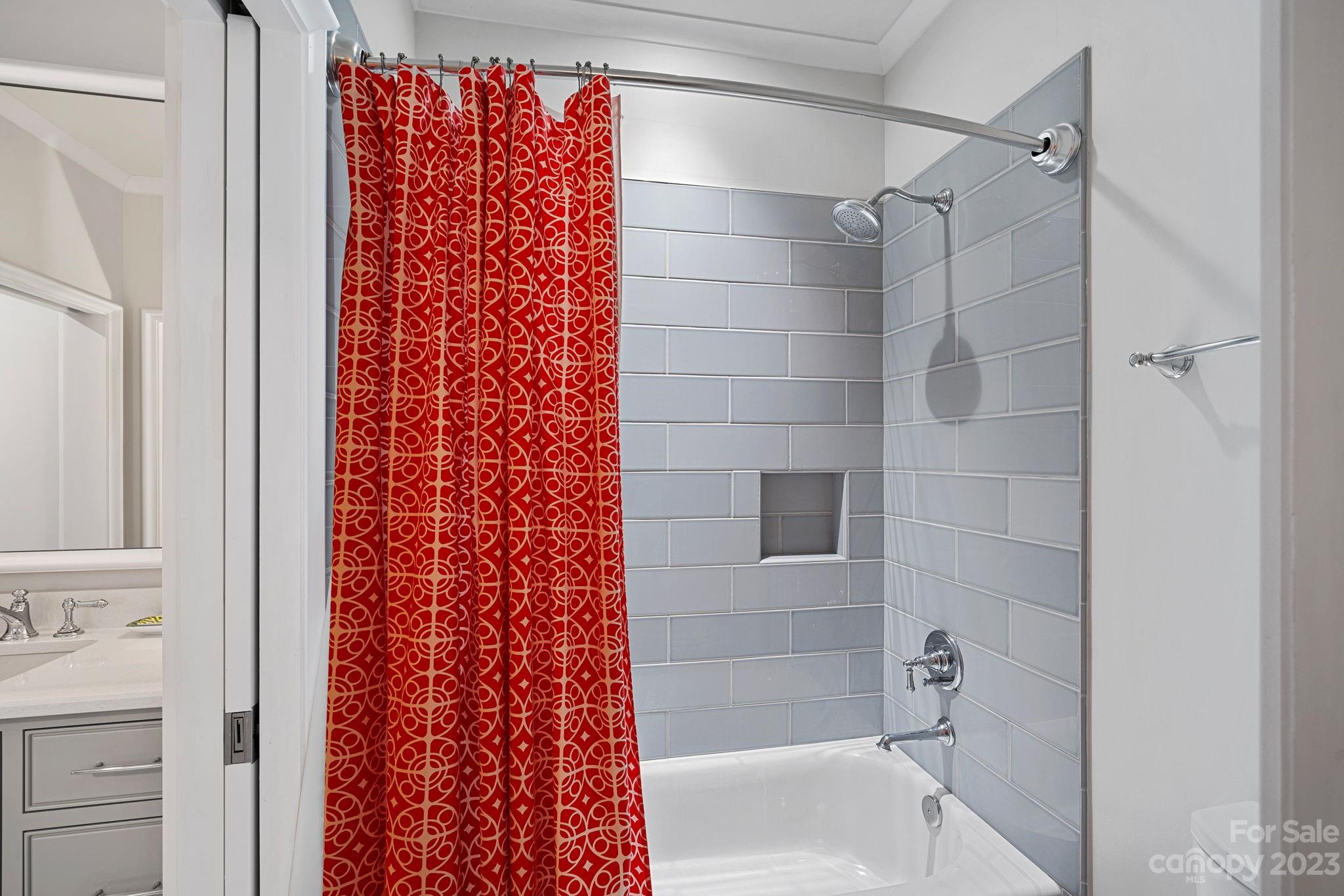 1401 Audubon Road Charlotte, NC 28211 - Photo 26 of 39 a bathroom with a shower curtain and a bath tub
