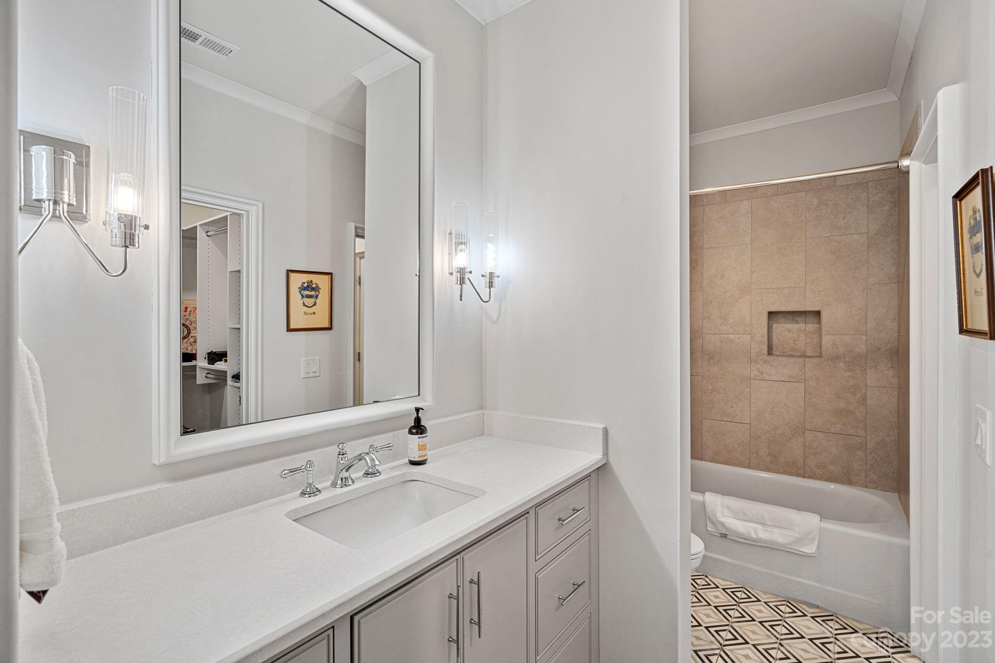 1401 Audubon Road Charlotte, NC 28211 - Photo 32 of 39 a bathroom with a sink and a mirror
