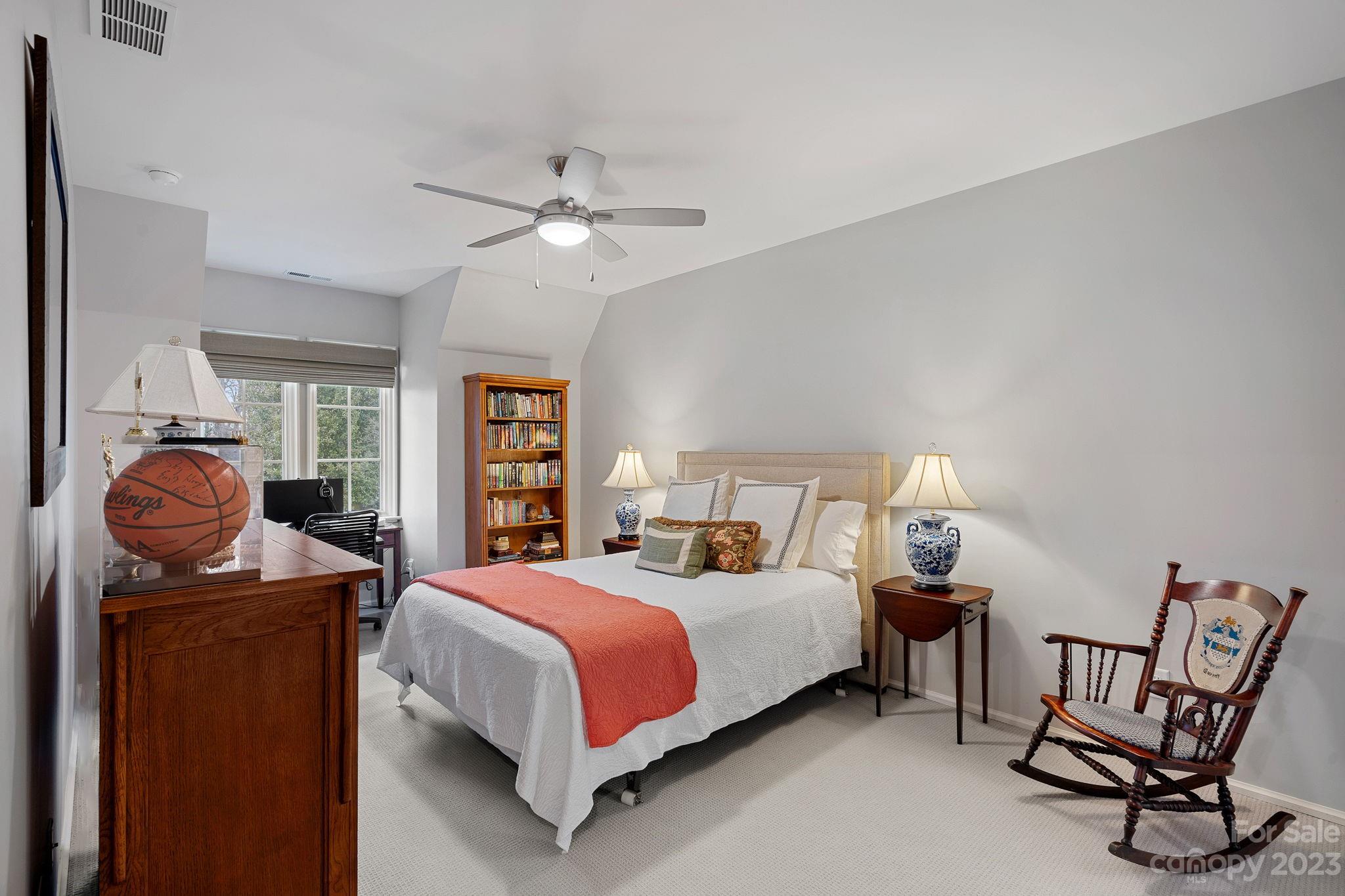 1401 Audubon Road Charlotte, NC 28211 - Photo 33 of 39 a bedroom with a bed and wooden floor