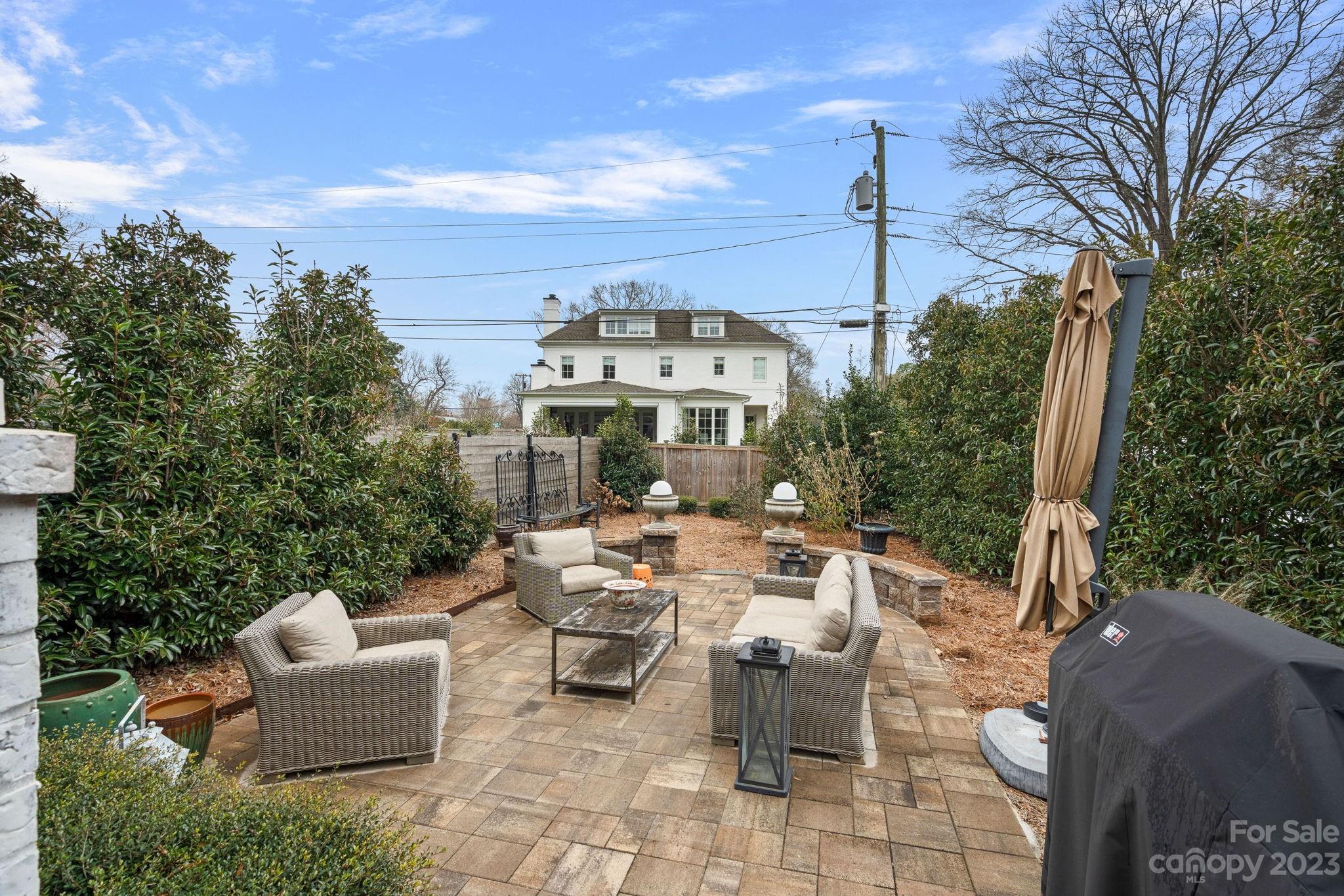 1401 Audubon Road Charlotte, NC 28211 - Photo 35 of 39 a view of a patio with couches table and chairs and potted plants