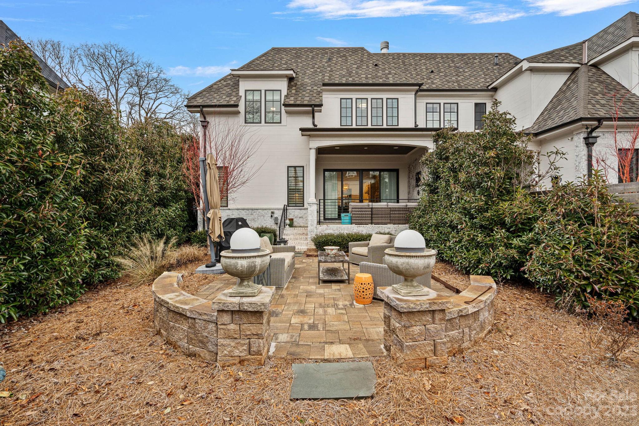 1401 Audubon Road Charlotte, NC 28211 - Photo 36 of 39 a view of a patio with couches table and chairs and potted plants
