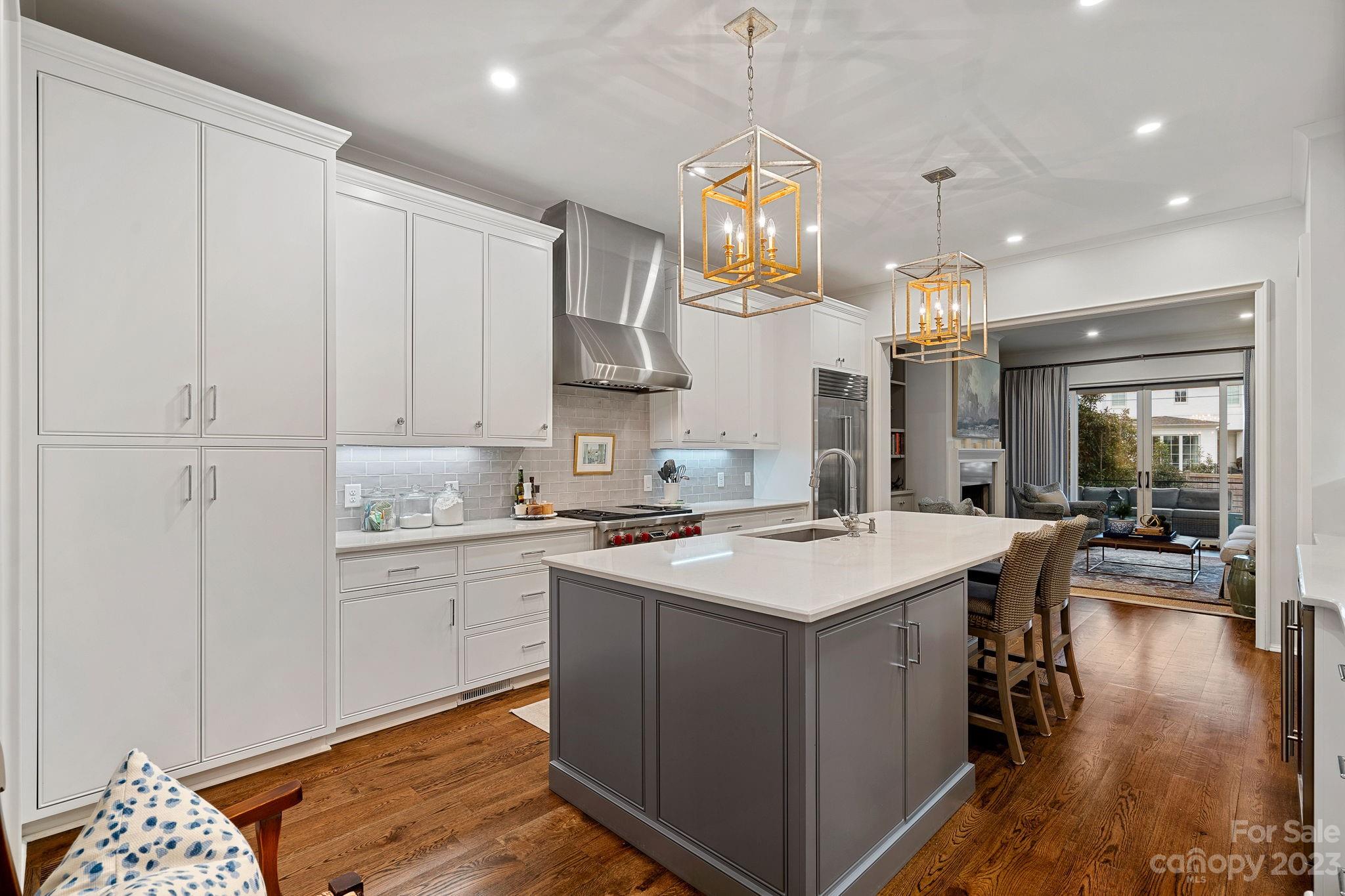 1401 Audubon Road Charlotte, NC 28211 - Photo 7 of 39 a kitchen that has a lot of cabinets in it and wooden floors