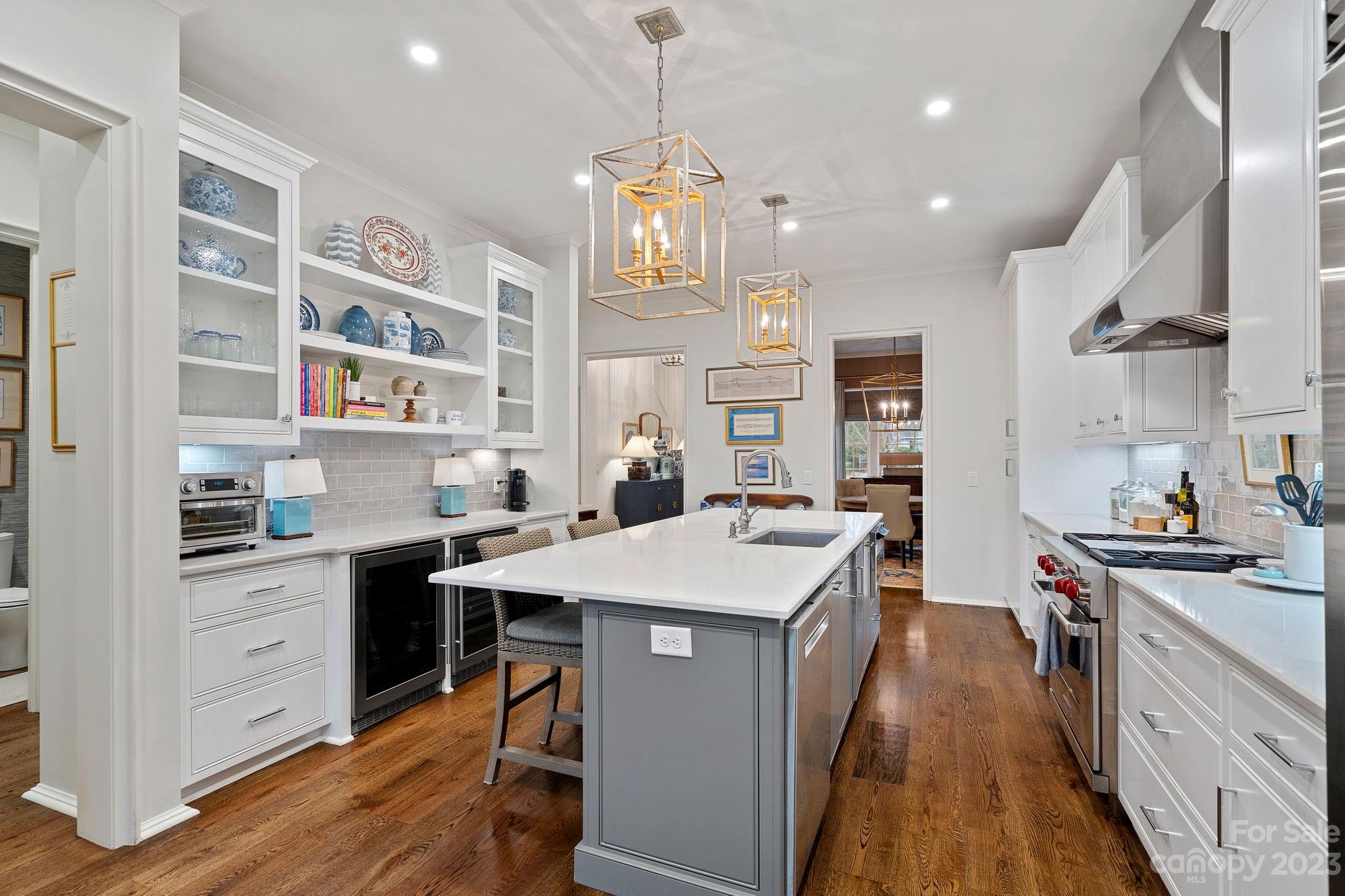 1401 Audubon Road Charlotte, NC 28211 - Photo 10 of 39 a kitchen that has a lot of cabinets in it and wooden floors
