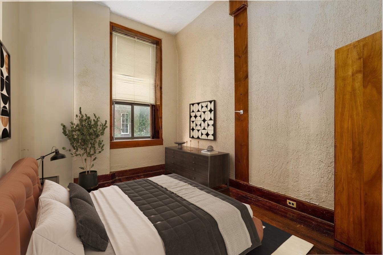 107 South Front Street, Unit 41 Memphis, TN 38103 - Photo 12 of 17 a bedroom with a bed and a window