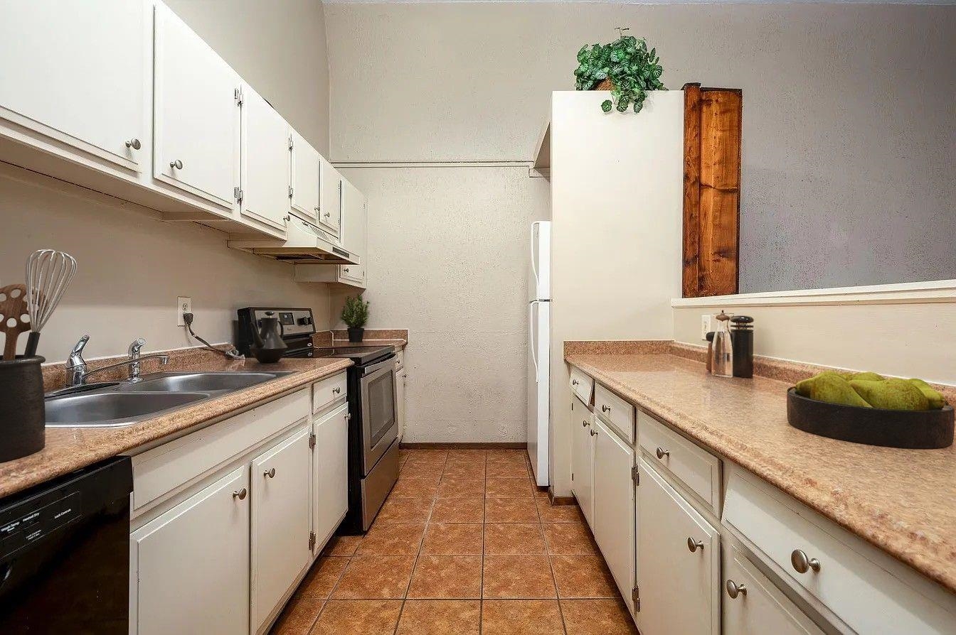 107 South Front Street, Unit 41 Memphis, TN 38103 - Photo 4 of 17 a kitchen with a sink and cabinets
